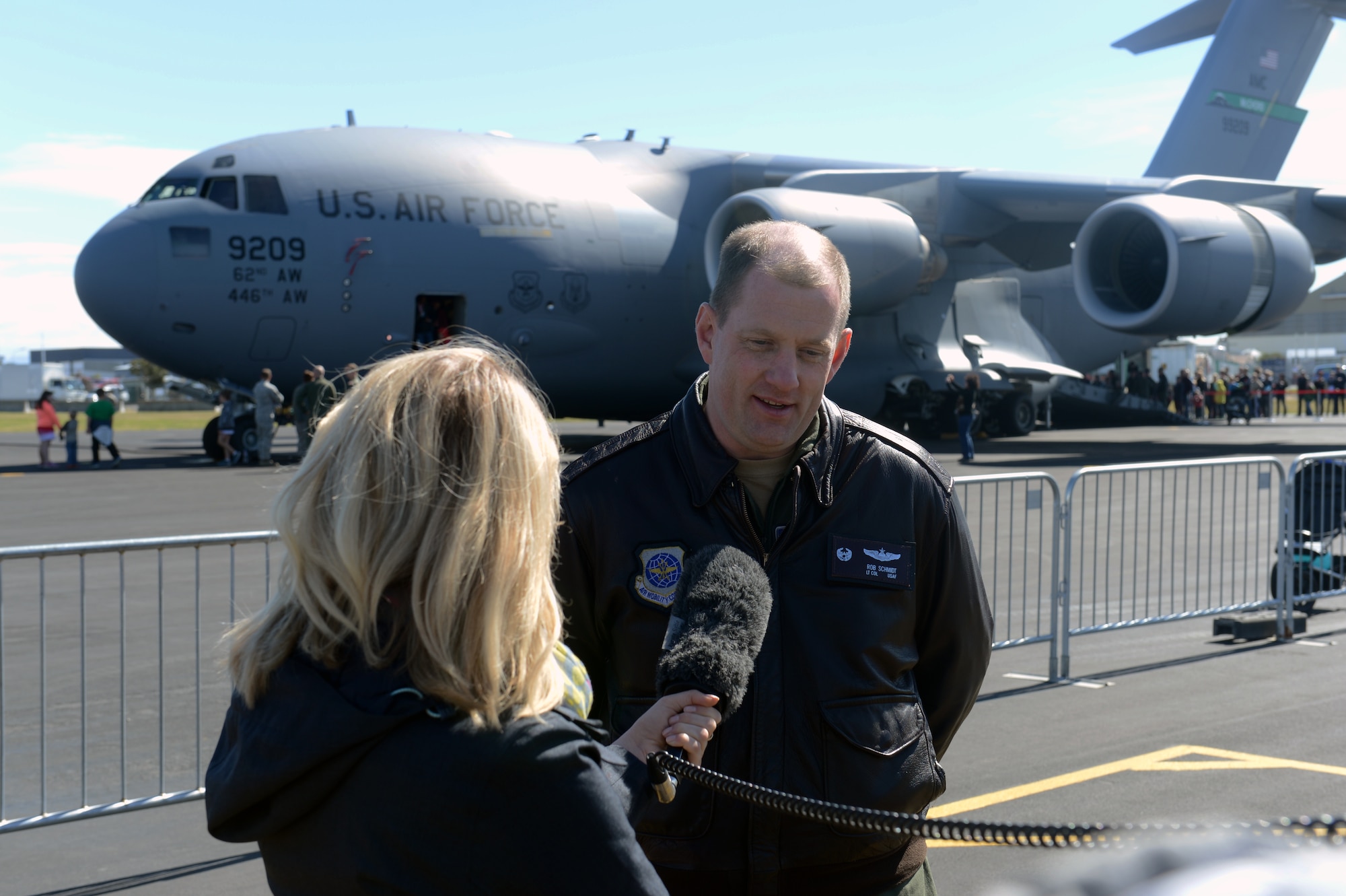 Lt. Col. Rob Schmidt talks with media in front of the C-17 Globemaster III, Oct. 5, 2014, as part of the U.S. Antarctic Program Day for IceFest 2014 at Christchurch, New Zealand. The day is used to educate the community members on the capabilities of the C-17 and allows them the first-hand experience of seeing the aircraft up close and personal. Schmidt is the 304th Expeditionary Airlift Squadron commander and 62nd Airlift Wing operations group deputy commander. (U.S. Air Force photo/Master Sgt. Todd Wivell)
