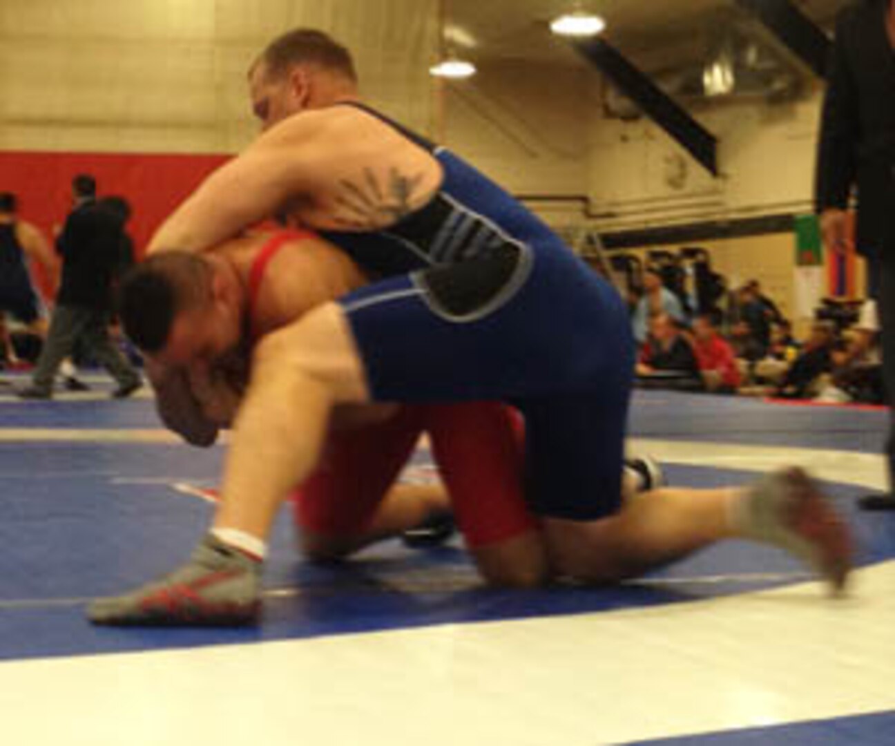 Marine Staff Sgt. David Arendt overpowers Fayssal SAIDANI (Algeria) in the 130kg Greco-Roman competition at the 29th CISM World Military Wresting Championship at Joint Base McGuire-Dix-Lakehurst, New Jersey 1-8 October.