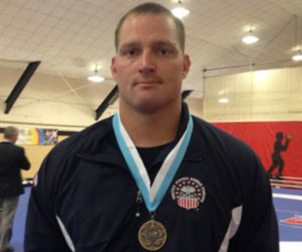 Marine Staff Sgt. David Arendt (Camp Lejeune, NC) with his bronze medal after competing in the 130 kg Greco-Roman competition at the 29th CISM World Military Wresting Championship at Joint Base McGuire-Dix-Lakehurst, New Jersey 1-8 October.