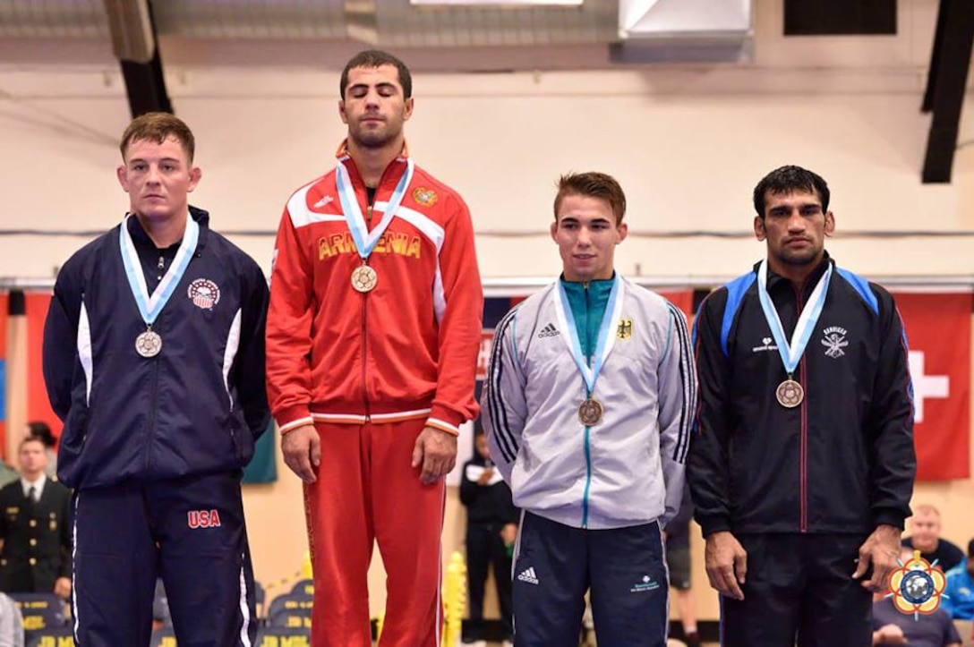 Marine First Lt. Bryce Saddoris (left) wins the silver medal in the 66kg Greco-Roman competition at the 29th CISM World Military Wresting Championship at Joint Base McGuire-Dix-Lakehurst, New Jersey 1-8 October.