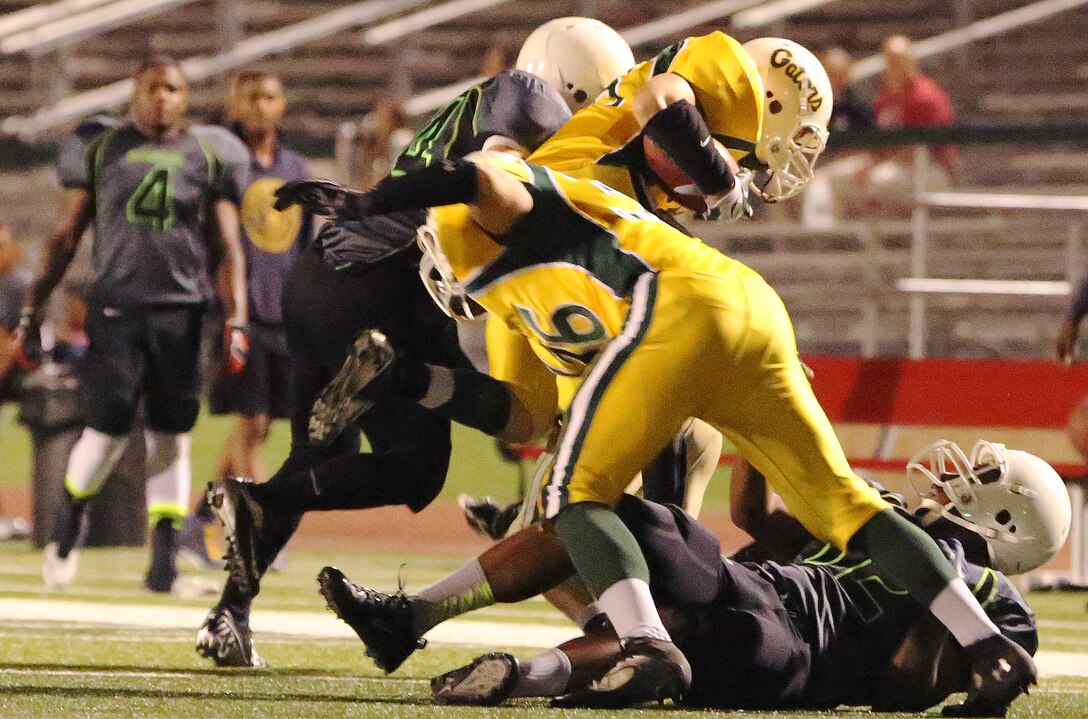 Marine Corps Base Spartans defeated the 3rd Amphibious Assault Battalion Gators with a score of 21-12 during a Commanding General's Cup football game at the Paige Fieldhouse football field, Oct. 7. 

(Photo by Cpl. Shaltiel Dominguez)