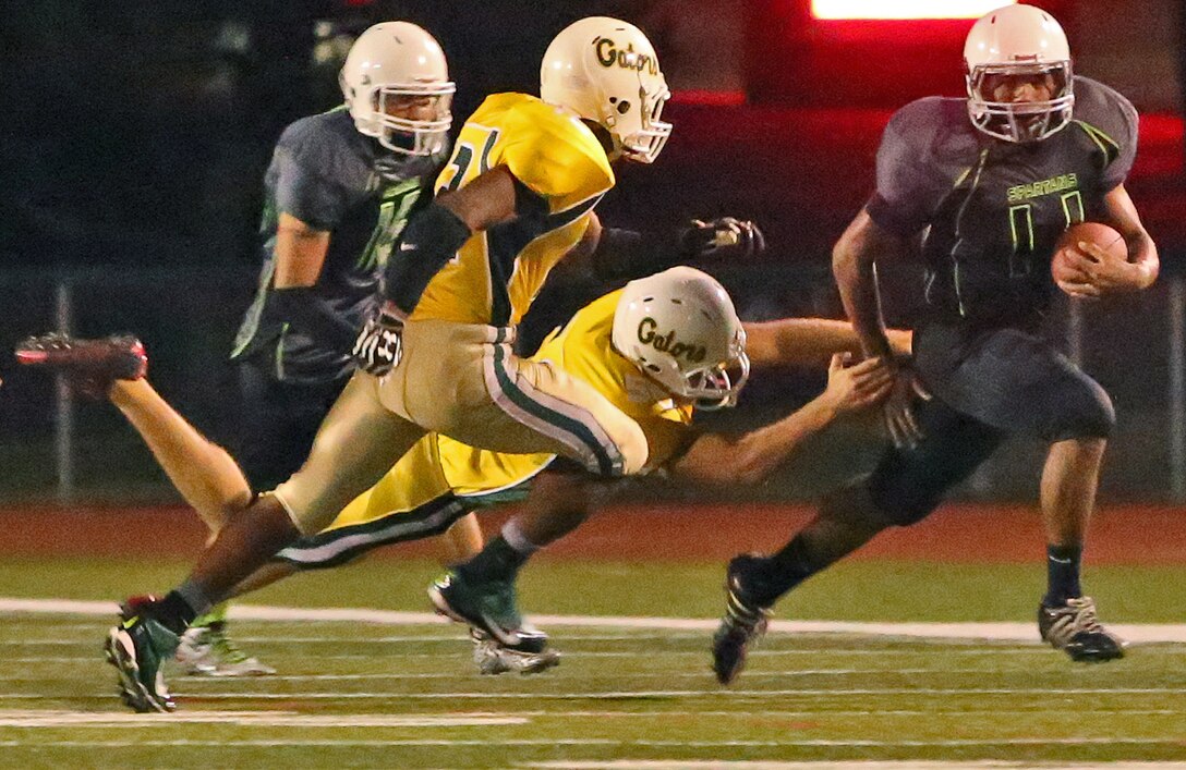 Marine Corps Base Spartans defeated the 3rd Amphibious Assault Battalion Gators with a score of 21-12 during a Commanding General's Cup football game at the Paige Fieldhouse football field, Oct. 7. 

(Photo by Cpl. Shaltiel Dominguez)