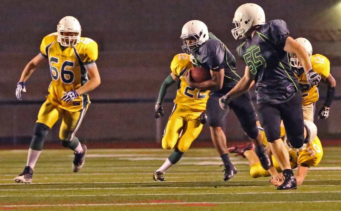 Marine Corps Base Spartans defeated the 3rd Amphibious Assault Battalion Gators with a score of 21-12 during a Commanding General's Cup football game at the Paige Fieldhouse football field, Oct. 7. 

(Photo by Cpl. Shaltiel Dominguez)