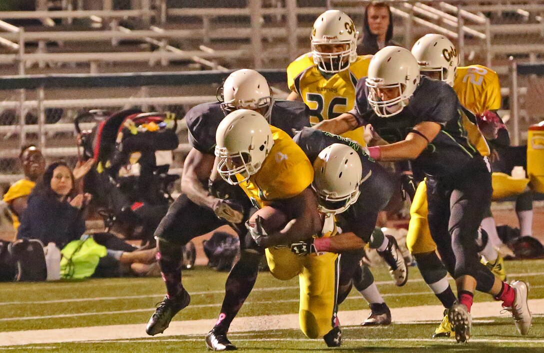 Marine Corps Base Spartans defeated the 3rd Amphibious Assault Battalion Gators with a score of 21-12 during a Commanding General's Cup football game at the Paige Fieldhouse football field, Oct. 7. 

(Photo by Cpl. Shaltiel Dominguez)