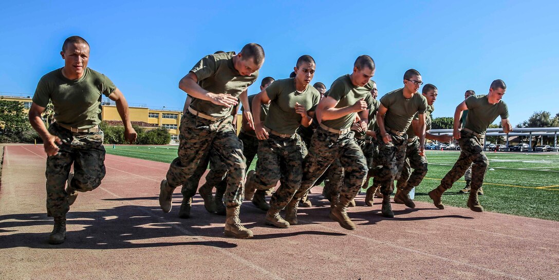 Recruits of Lima Company, 3rd Recruit Training Battalion, sprint during the 880-yard run portion of the Combat Fitness Test at Marine Corps Recruit Depot San Diego, Sept. 25. The Combat Fitness Test is comprised of an 880-yard run, ammunition can lifts and a maneuver under fire.