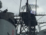 Lowering of the CISM Flag from the mast of the Battleship USS New Jersey during the closing ceremony of the 29th CISM World Military Wresting Championship at Joint Base McGuire-Dix-Lakehurst, New Jersey 1-8 October.