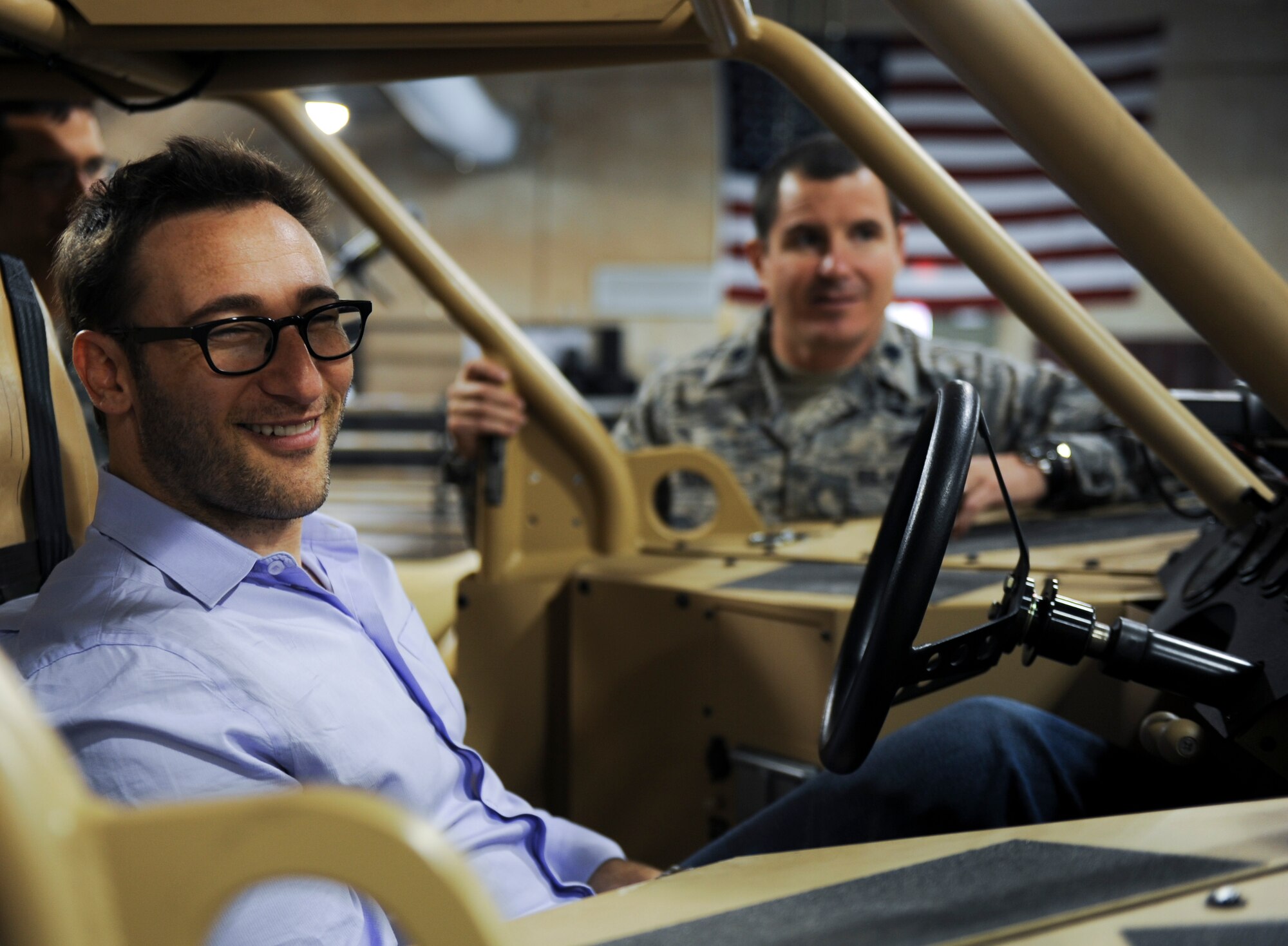 Simon Sinek, an internationally renowned speaker and author, sits inside of a Guardian Angel Air-Deployable Rescue Vehicle while visiting the 58th Rescue Squadron during a visit to Nellis Air Force Base, Nev., Oct. 1, 2014. Sinek was visiting Nellis Air Force Base to get a better understanding of the mission and capabilities of the U.S. Air Force’s ground forces. (U.S. Air Force photo by Airman 1st Class Mikaley Towle)