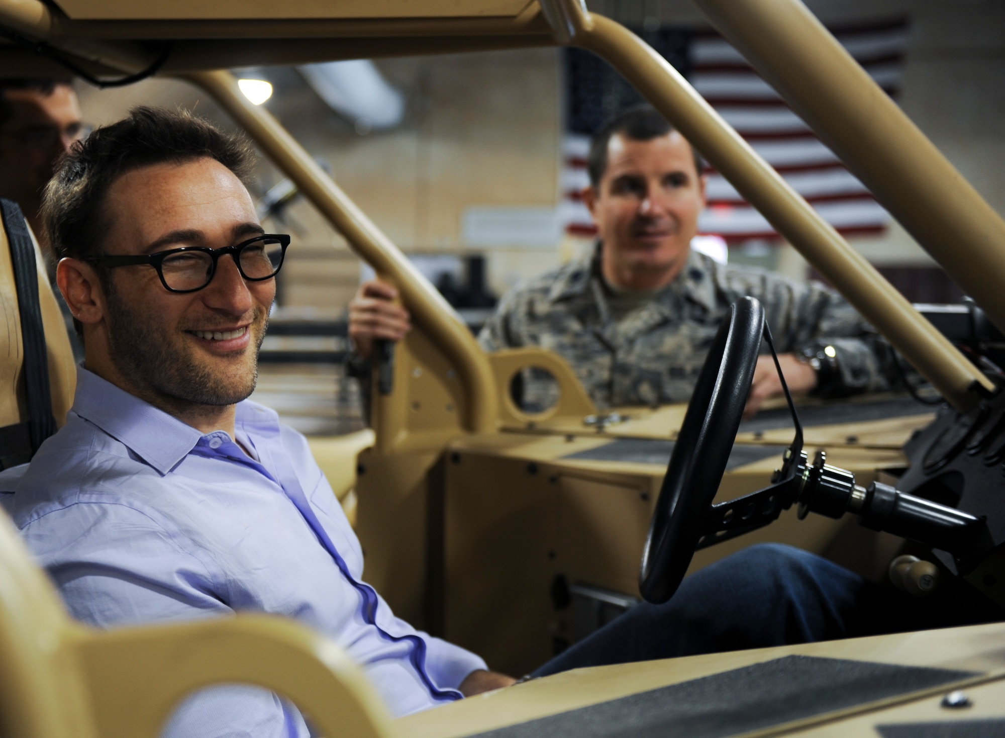 Simon Sinek, an internationally renowned speaker and author, sits inside of a Guardian Angel Air-Deployable Rescue Vehicle while visiting the 58th Rescue Squadron during a visit to Nellis Air Force Base, Nev., Oct. 1, 2014. Sinek was visiting Nellis Air Force Base to get a better understanding of the mission and capabilities of the U.S. Air Force’s ground forces. (U.S. Air Force photo by Airman 1st Class Mikaley Towle)