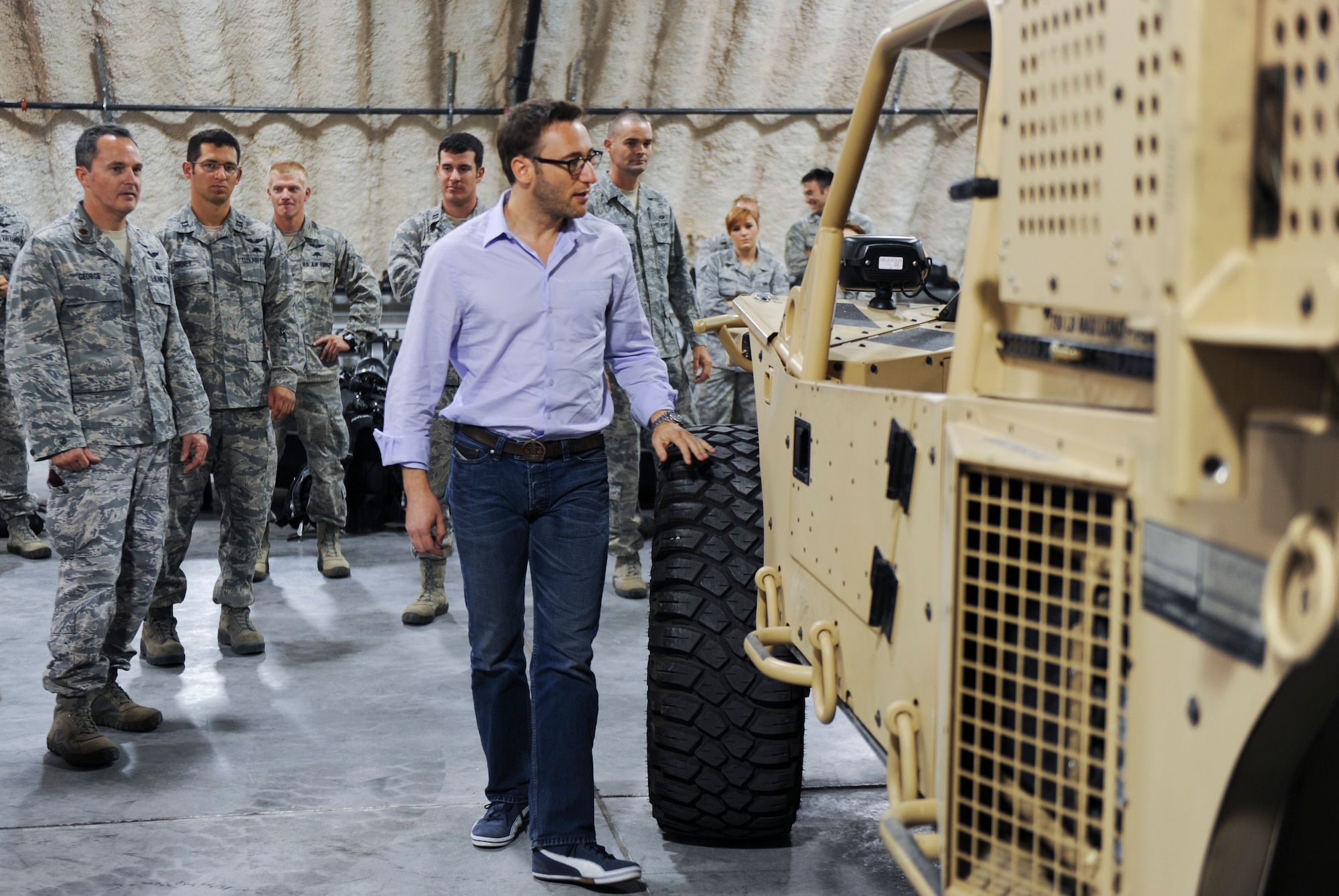 Simon Sinek, an internationally renowned speaker and author, looks inside of a Guardian Angel Air-Deployable Rescue Vehicle while visiting the 58th Rescue Squadron at Nellis Air Force Base, Nev., Oct. 1, 2014. The GAARV is a multi-purpose utility vehicle intended to help combat search and rescue teams retrieve individuals who have been isolated. (U.S. Air Force photo by Airman 1st Class Mikaley Towle)