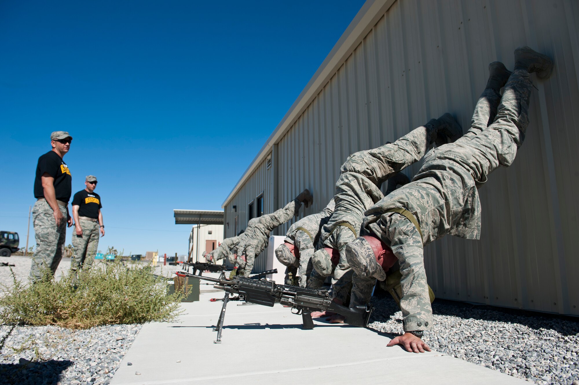 Students in the Ranger Assessment Course receive motivational training from their instructors at the Nevada Test and Training Range, Oct. 3, 2014. The RAC offers Airmen the opportunity to develop and prove themselves in an intense training environment to see whether or not they are ready to attend the U.S. Army Ranger School. (U.S. Air Force photo by Airman 1st Class Thomas Spangler)