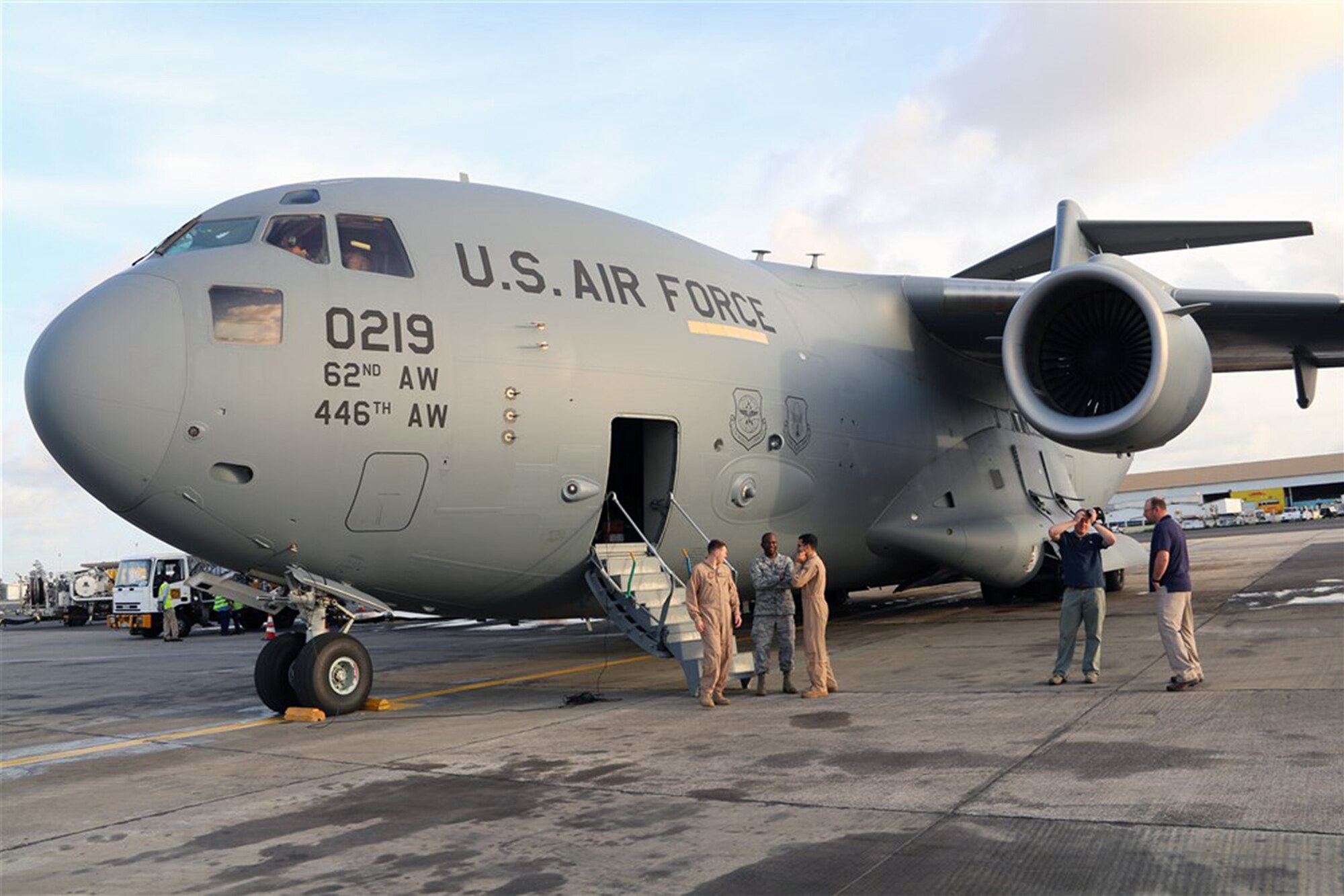 A Joint Base Lewis-McChord C-17 Globemaster III aircraft arrived in Liberia Oct. 8, with the first shipment of increased military equipment and personnel for the anti-Ebola fight, Operation Unified Assistance. The cargo included a heavy duty forklift, a drill set and generator and a team of seven military personnel, including engineers and airfield specialists. (photo courtesy/U.S. Embassy, Monrovia, Liberia)