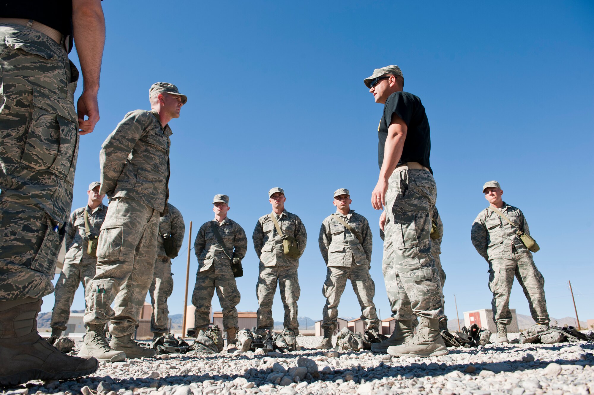 A Ranger Assessment Course instructor (right), informs the RAC class leader that he needs to improve his leadership skills at the Nevada Test and Training Range, Oct. 3, 2014. If the students successfully graduate from the course they may be given more opportunities to test and improve their leadership skills in even more stressful environments at the U.S. Army Ranger School. (U.S. Air Force photo by Airman 1st Class Thomas Spangler)