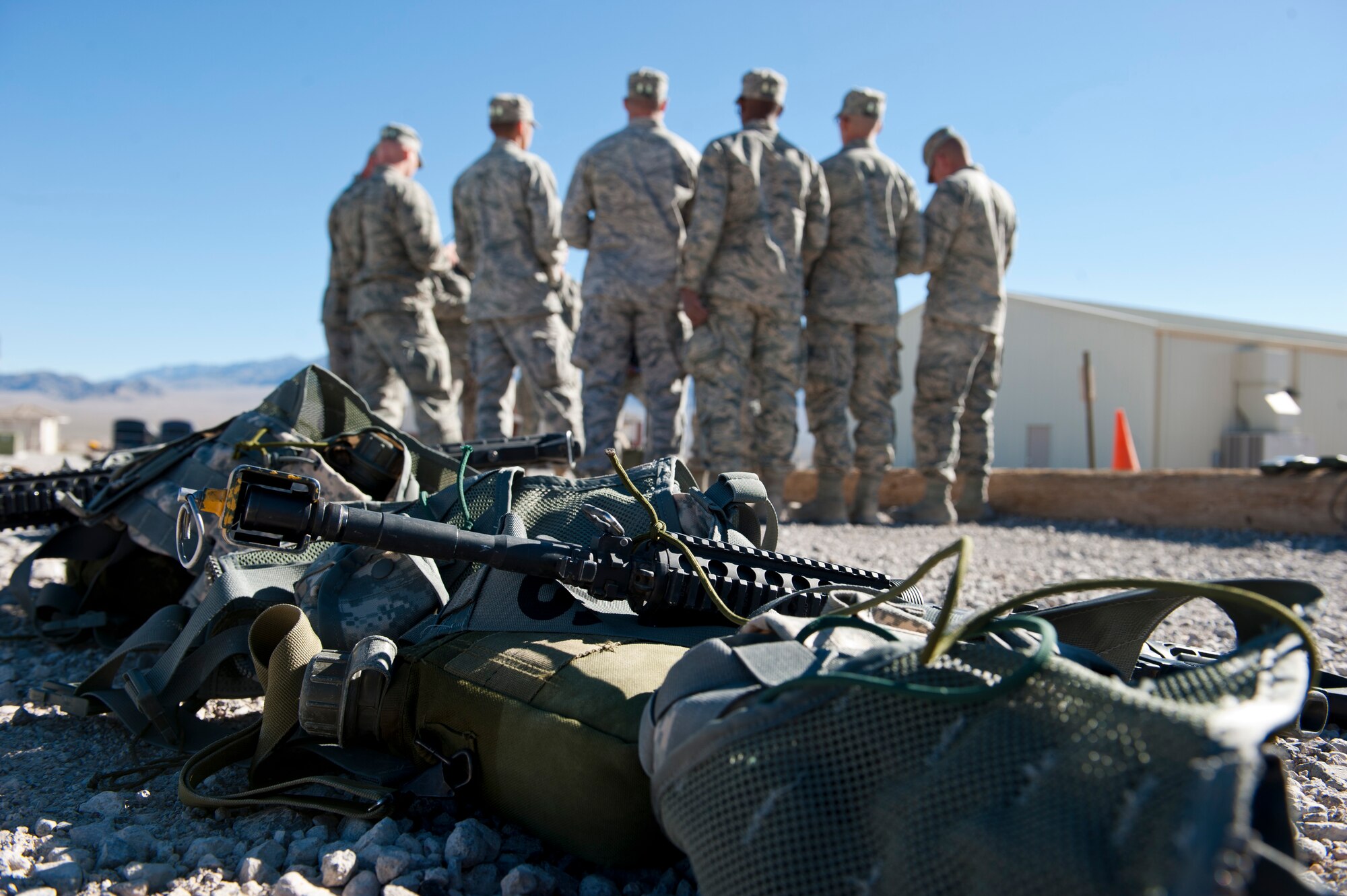 Students in the Ranger Assessment Course are taught how to properly use radios at the Nevada Test and Training Range, Oct. 3, 2014. During the course, students are taught how to properly use and maintain radios and a variety of weapons and tactics that are necessary to execute a suitable foot patrol. Students will eventually be required to use these skills on foot patrols where they will encounter realistic ambushes. (U.S. Air Force photo by Airman 1st Class Thomas Spangler)