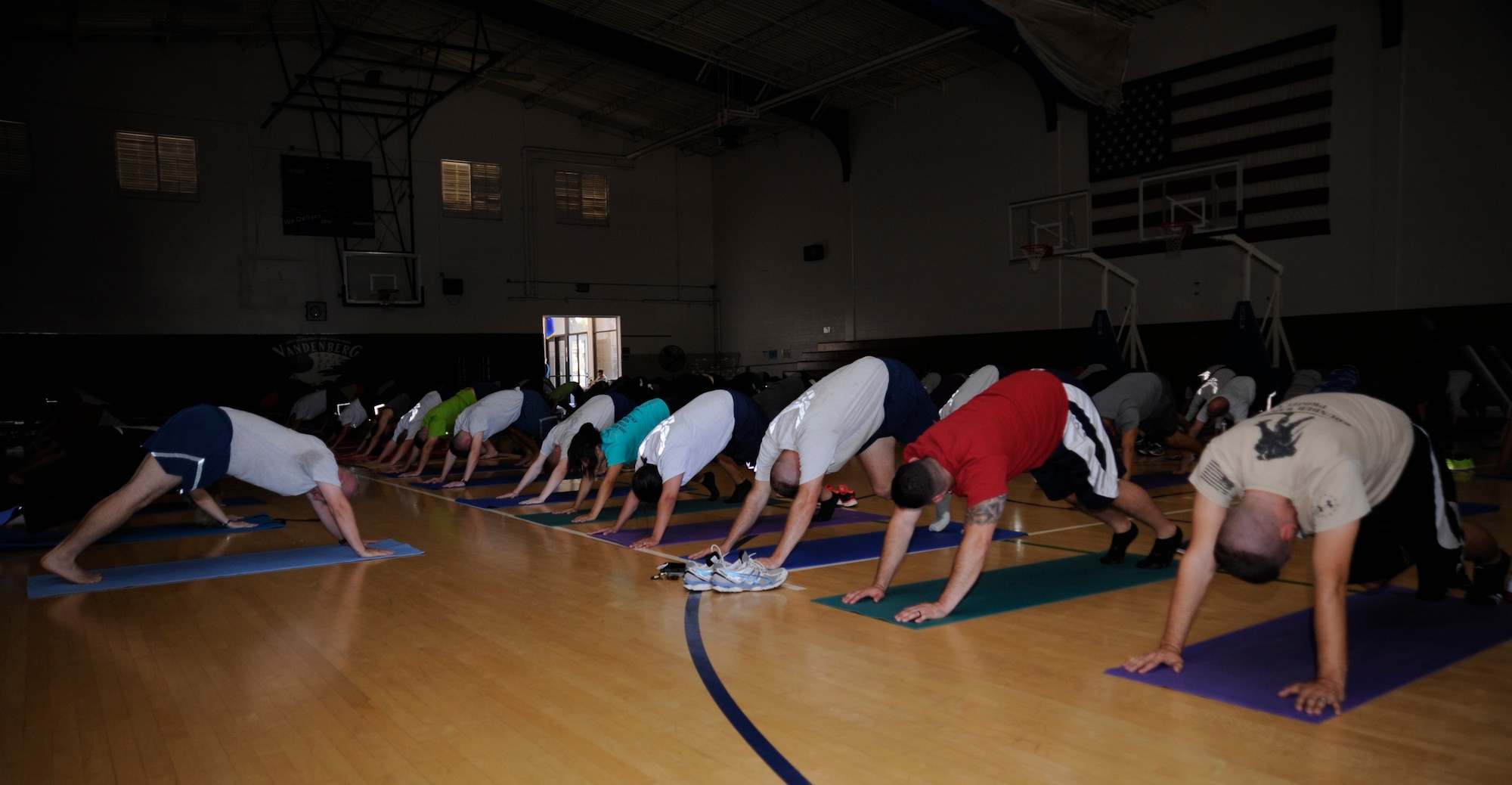 The 30th Operations Group Airmen learn yoga poses at the fitness annex, Oct. 1, 2014, Vandenberg Air Force Base, Calif. The 30th Operations Group uses yoga to improve their fitness as a part of their monthly physical fitness session. (U.S. Air Force photo by Airman First Class Ian Dudley/Released)