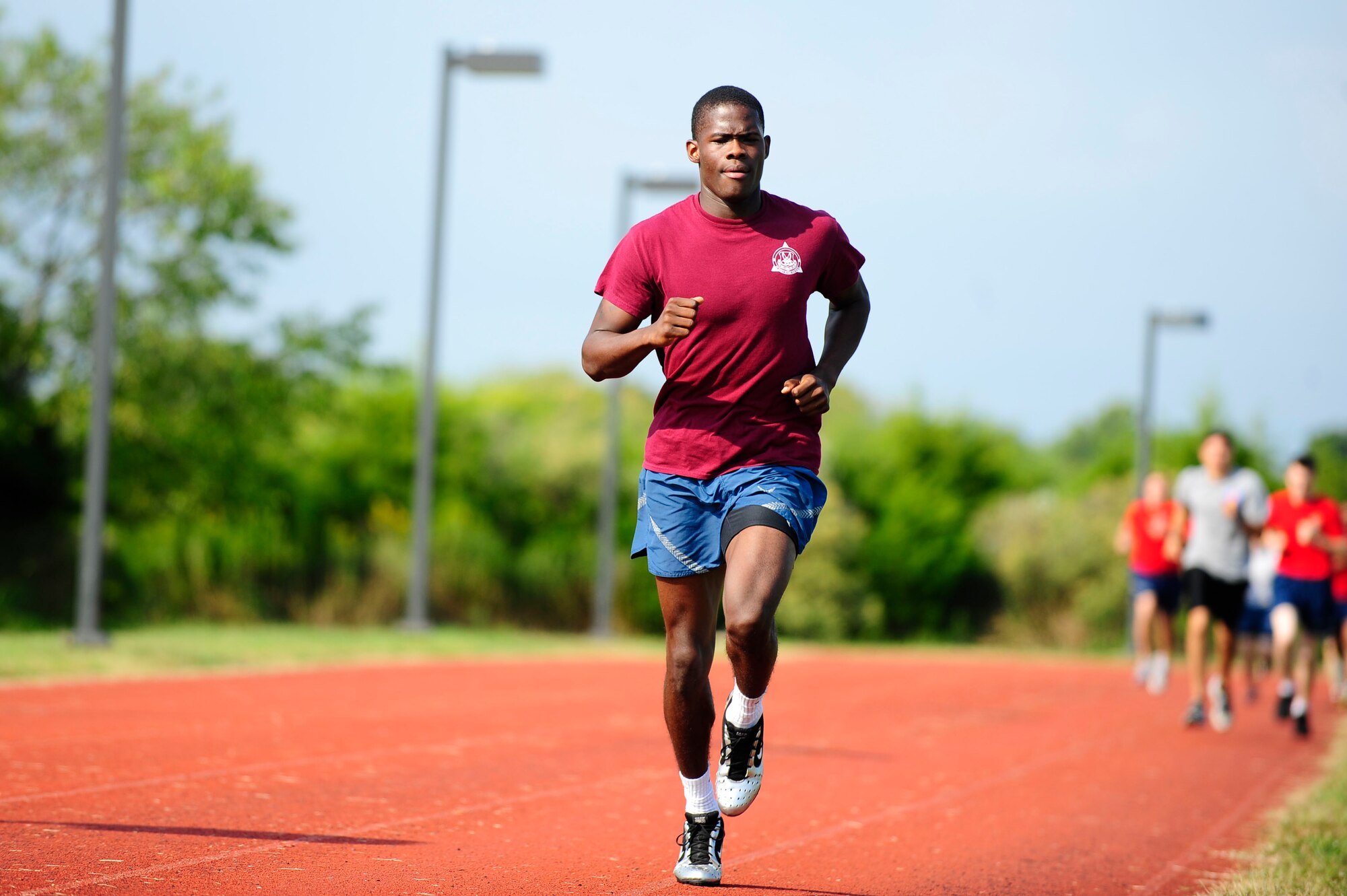 U.S. Air Force Senior Airman Dakota Porter, Air Force Targeting Center team member, runs the 1,600 meter race during the Joint Base Langley-Eustis Warrior Olympics at Langley Air Force Base, Va., Oct. 3, 2014. Dakota finished in 5 minutes 15 seconds, and competed in multiple events throughout the day. (U.S. Air Force photo by Staff Sgt. Natasha Stannard/Released)