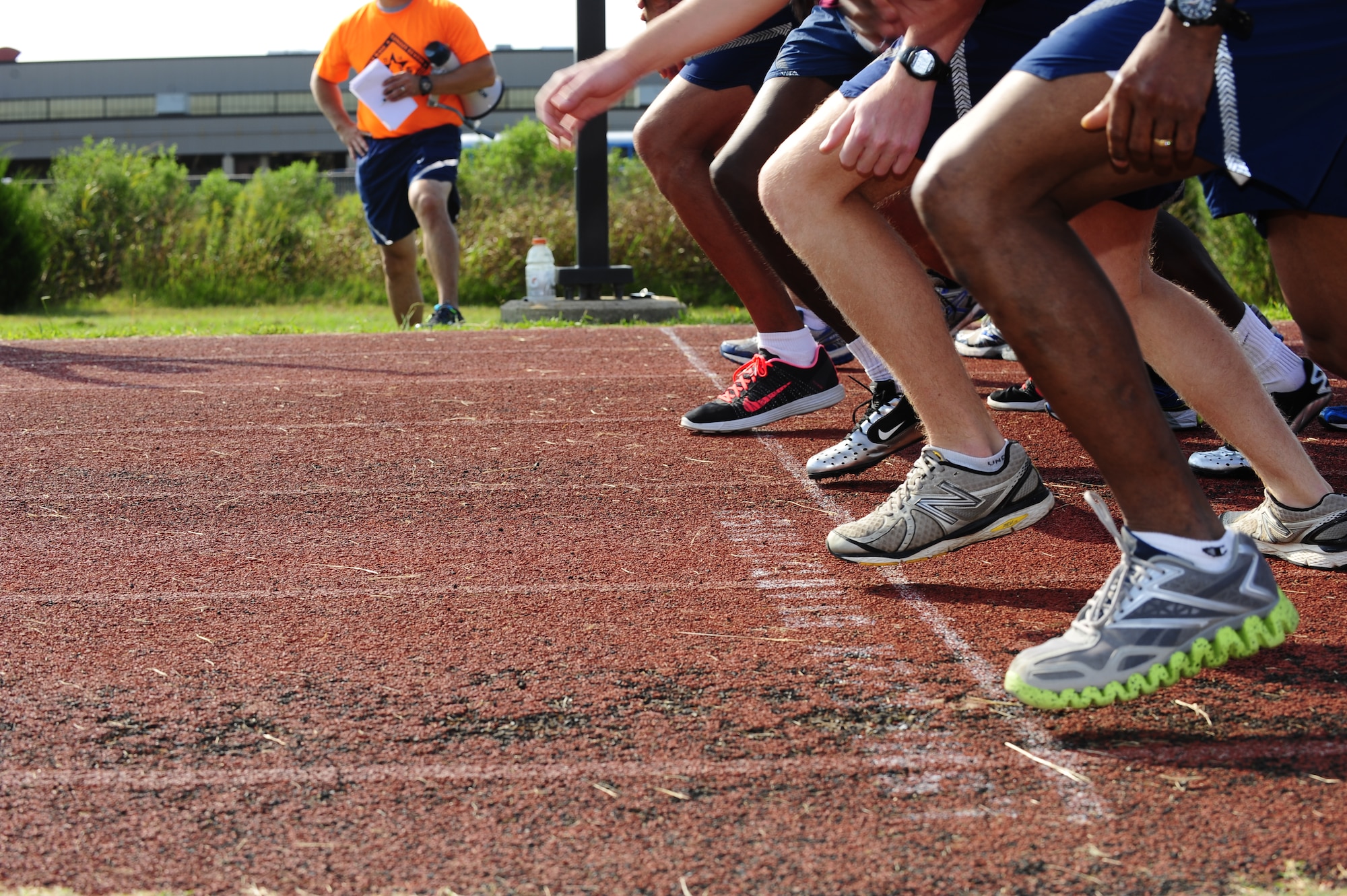 Runners take-off for the 1,600 meter race during the Joint Base Langley-Eustis Warrior Olympics at Langley Air Force Base, Va., Oct. 3, 2014. The base hosted the Olympics to promote fitness and morale amongst the units. (U.S. Air Force photo by Staff Sgt. Natasha Stannard/Released)
