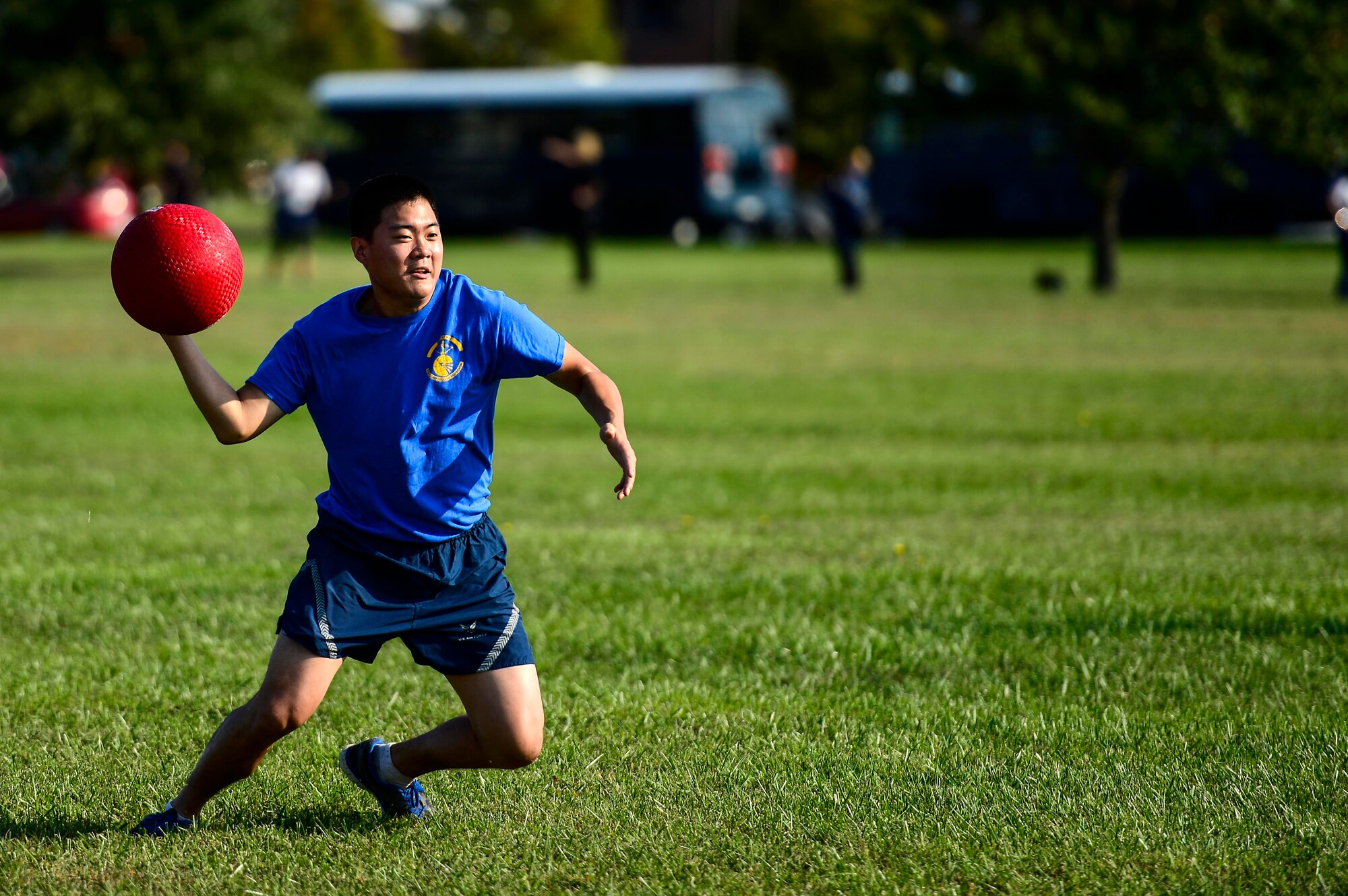 U.S. Air Force Senior Airman Sung Kim, 633rd Comptroller Squadron team member, participates in a kickball tournament during the Joint Base Langley-Eustis Warrior Olympics at Langley Air Force Base, Va., Oct. 3, 2014. The Olympics was hosted as a way to boost morale and promote fitness through various sporting tournaments held throughout the day. (U.S. Air Force photo by Senior Airman Kayla Newman/Released)