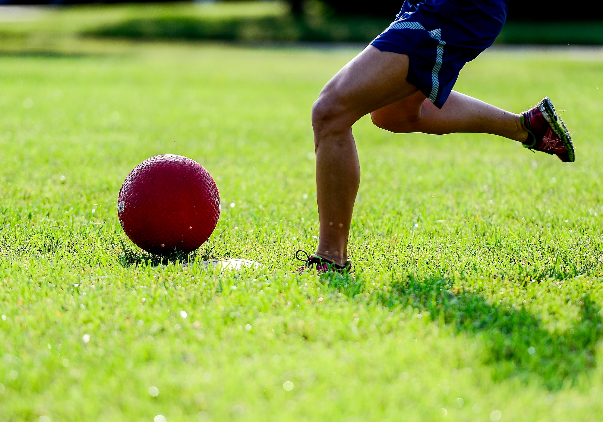 A U.S. Air Force Airman plays kickball during the Joint Base Langley-Eustis Warrior Olympics at Langley Air Force Base, Va., Oct. 3, 2014. Kickball was one of 14 sporting events held during the Olympics. (U.S. Air Force photo by Senior Airman Kayla Newman/Released)
