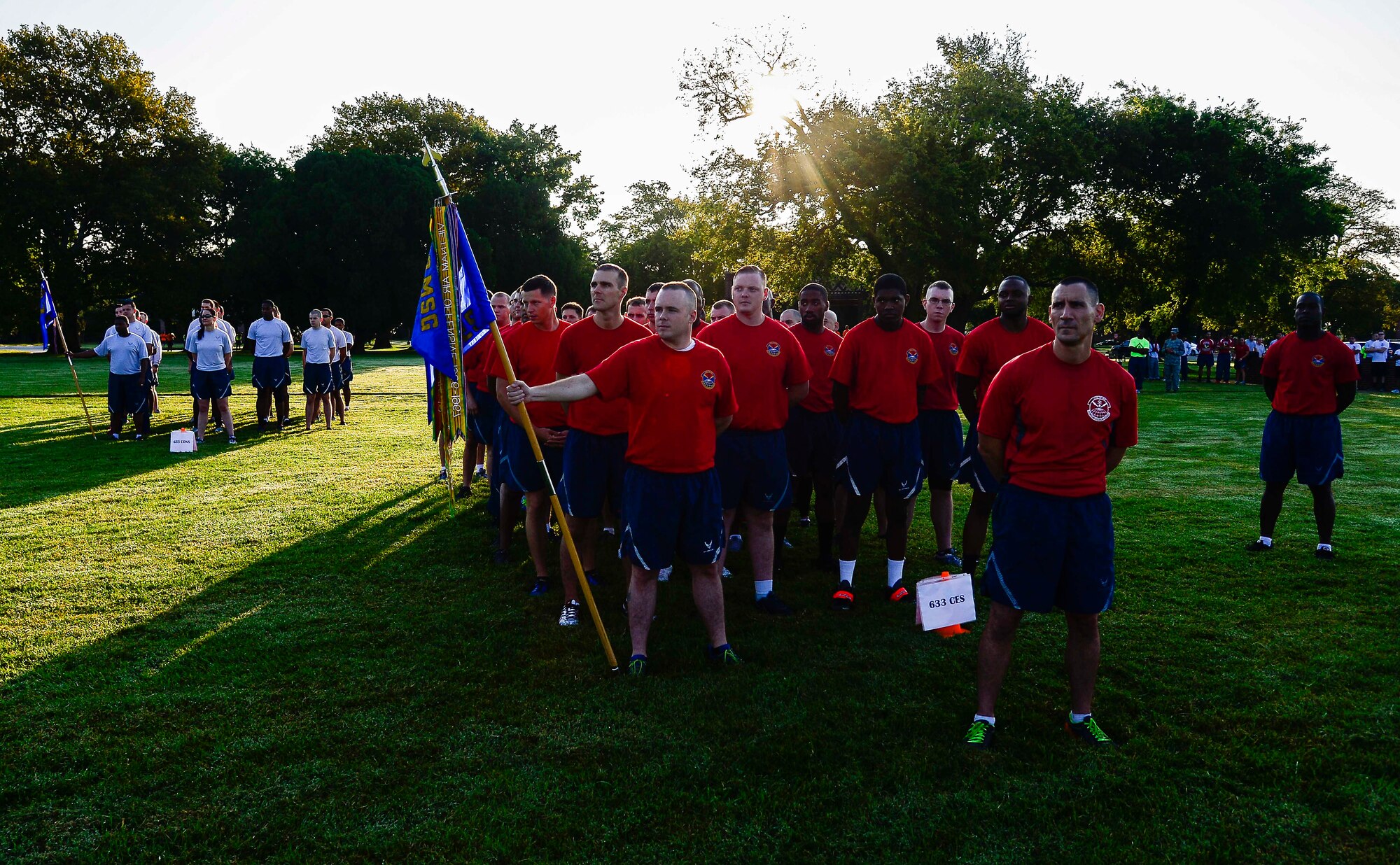 U.S. Air Force Airmen assigned to the 633rd Civil Engineer Squadron await a formation run during the Joint Base Langley-Eustis Warrior Olympics at Langley Air Force Base, Va., Oct. 3, 2014. At the end of the Olympics, the Commander’s Cup was awarded to the 633rd CES, who accumulated the most points throughout the day’s events.  (U.S. Air Force photo by Senior Airman Kayla Newman/Released)