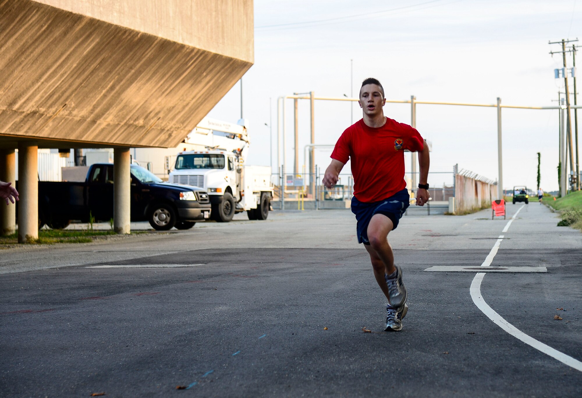 U.S. Air Force 2nd Lt. Eric Danko, 633rd Civil Engineer Squadron team member, finishes first in the Joint Base Langley-Eustis Warrior Olympics 5k at Langley Air Force Base, Va., Oct. 3, 2014. Along with the 5k, the day included volleyball, ultimate football, weightlifting, relay races and more. (U.S. Air Force photo by Senior Airman Kayla Newman/Released)