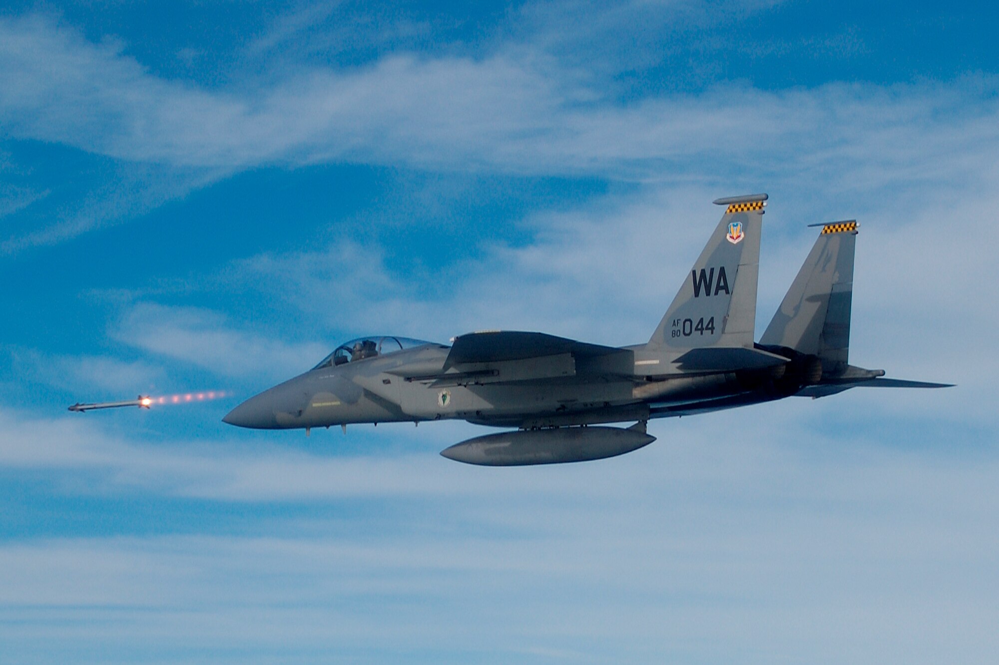 An F-15 Strike Eagle fires a missile during a Weapon System Evaluation Program mission. During the WSEP, the 83rd Fighter Weapons Squadron evaluates the total air-to-air weapons systems, including aircraft, weapon delivery systems, weapons, aircrews, support equipment, technical data and maintenance actions. (Courtesy Photo)