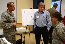 Capt. James Kash, left, deputy base engineer civil engineer with the 111th Attack Wing, Greg Wills, with the National Guard Bureau A7 and Lt. Col. Jacqueline Siciliano, Horsham Air Guard Station’s environmental manager were on hand to greet and speak with area residents during a town hall meeting held at the Horsham Community Center on Oct. 7, 2014.