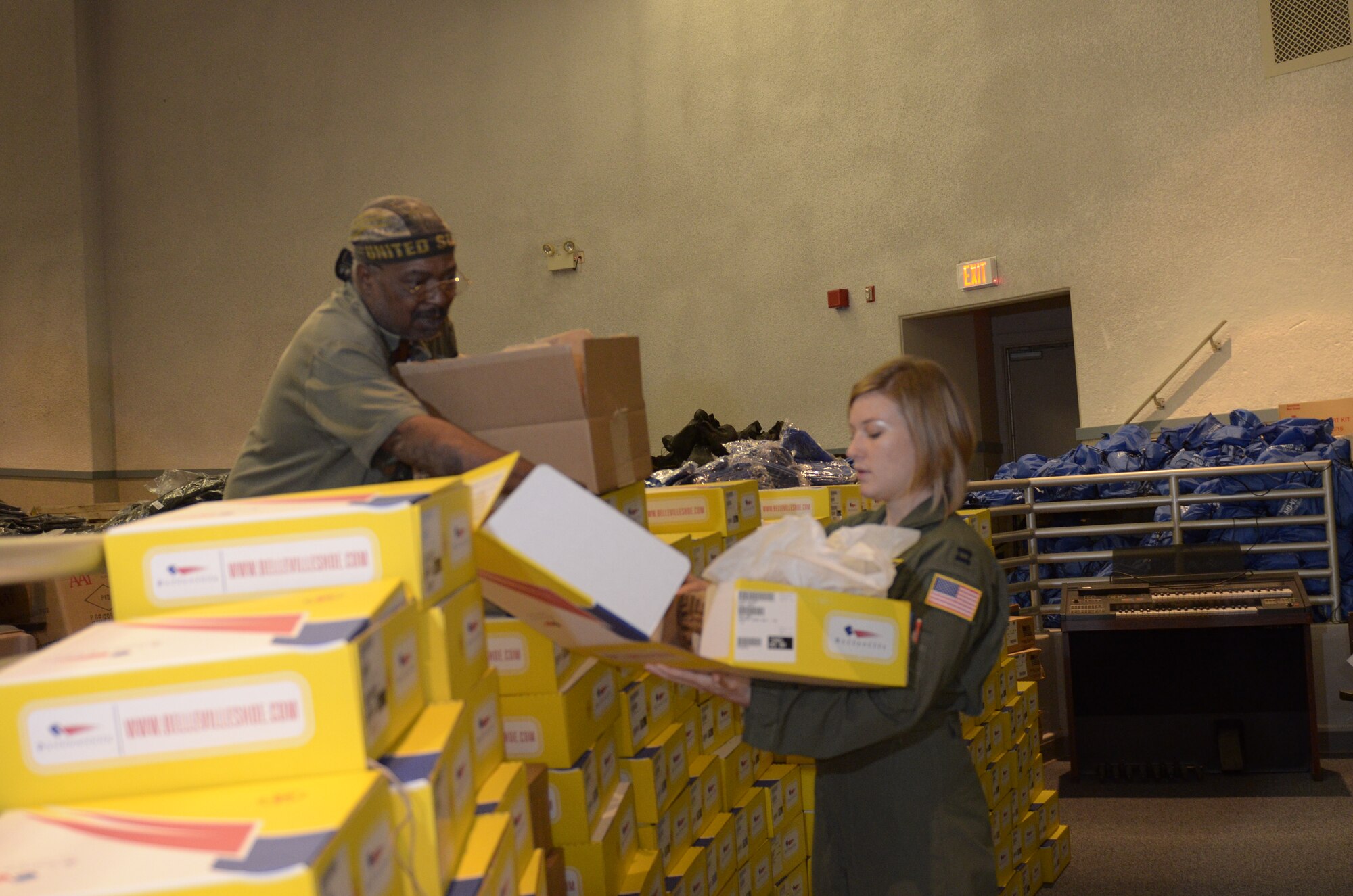 WRIGHT-PATTERSON AIR FORCE BASE, Ohio - Capt. Jennifer Byrne, 89th Airlift Squadron, helps sort through clothing items during the Dayton Veterans Affairs Medical Center Homeless Vets Stand Down, Sept. 5, 2014. A dozen members from the wing volunteered to support the event by sorting and handing out clothing and other items to more than 150 homeless vets. (U.S. Air Force photo/Senior Airman Devin Long)