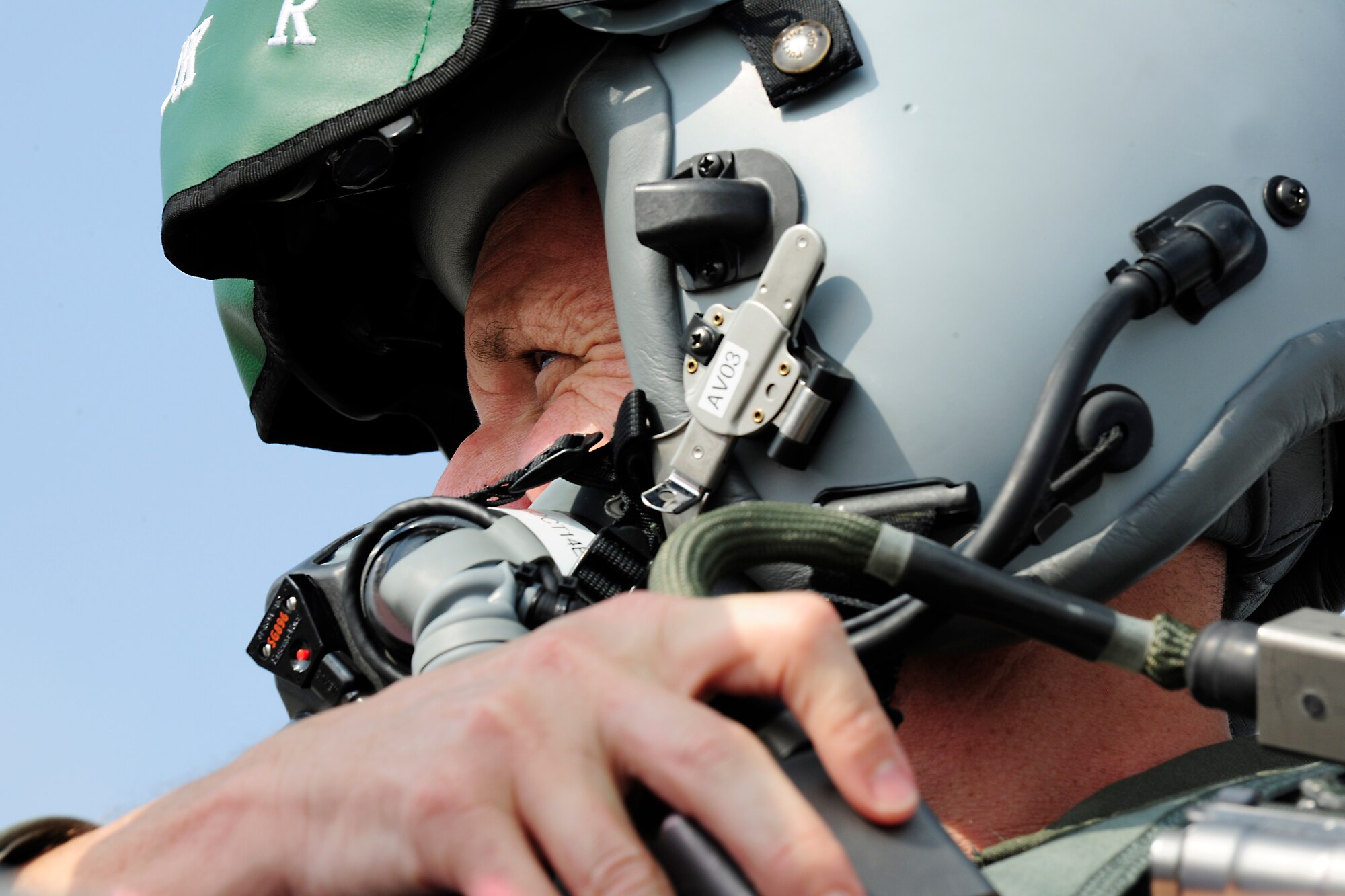 Col. Anthony Abernathy, 31st Operations Group commander, establishes communications with Airman 1st Class Matthew Galati, 31st Aircraft Maintenance Squadron crew chief, before taxying onto the flightline, Oct. 7, 2014, at Aviano Air Base, Italy. Due to F-16 Fighting Falcon engine noise, a crew chief and pilot must communicate through a two-way communication system. (U.S. Air Force photo/Airman 1st Class Ryan Conroy) 