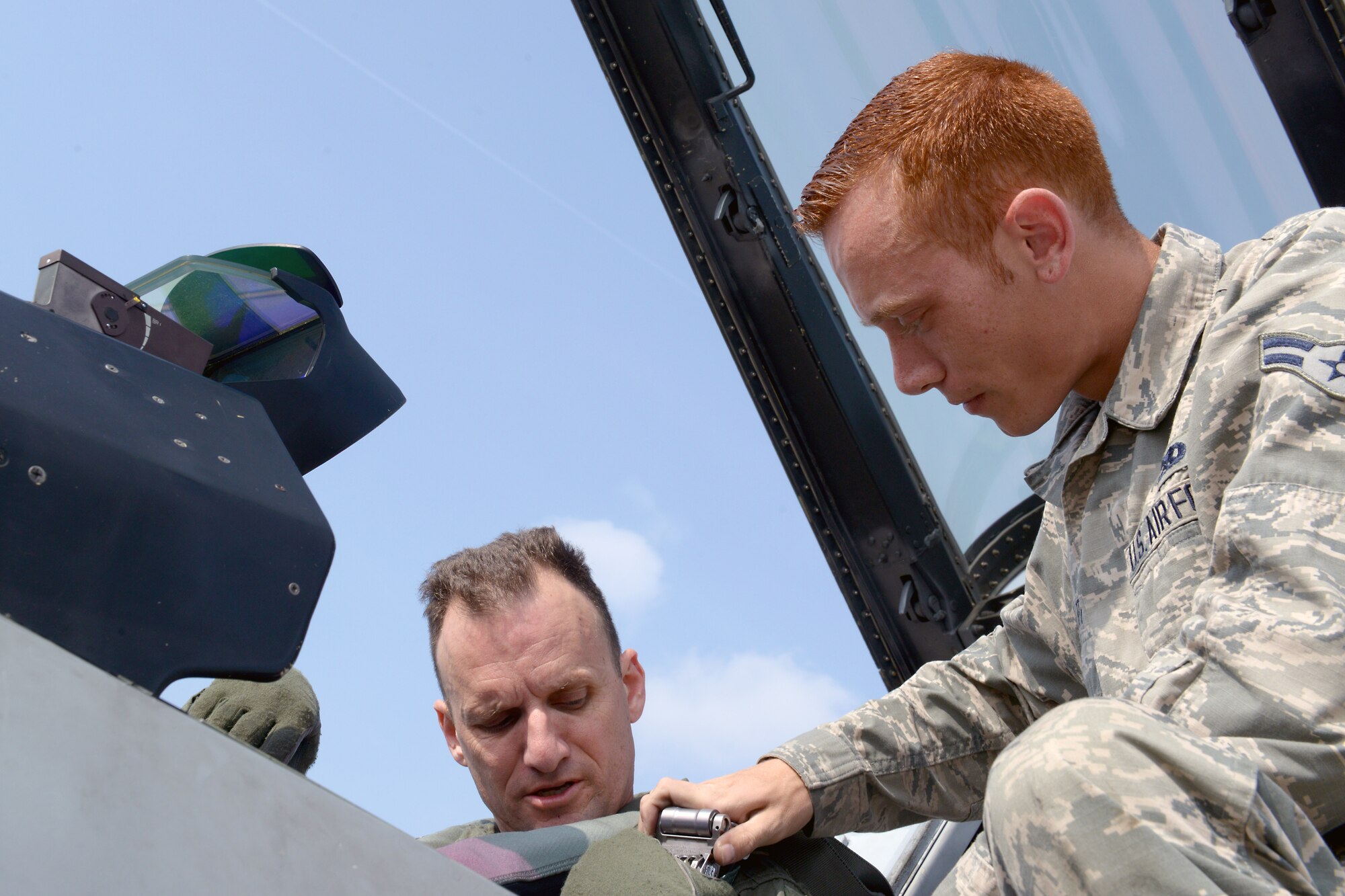 Airman 1st Class Matthew Galati, 31st Aircraft Maintenance Squadron crew chief, marshals an F-16 Fighting Falcon to taxi onto the flightline, Oct. 7, 2014, at Aviano Air Base, Italy. Aircraft marshalling is a visual signaling between ground personnel and pilots and serves as an alternative to radio communications. (U.S. Air Force photo/Airman 1st Class Ryan Conroy) 