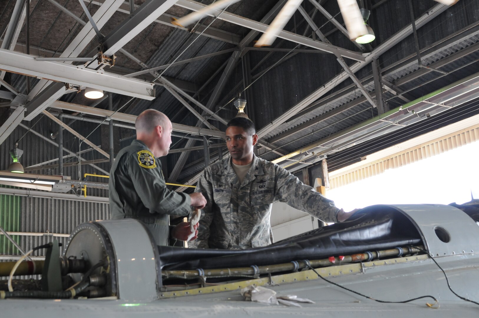 Col. Alexander Smith, 502nd Installation Support Group commander, learns about T-38C Talon maintenance during an immersion tour of the 12th Flying Training Wing September 19, 2014 at Joint Base San Antonio-Randolph.  The immersion tour was held for members of the 502nd ISG and 502nd Security Forces and Logistics Support Group to get to know the flying operations conducted from JBSA-Randolph that their groups support.  (United States Air Force photo by Laura McAndrews/Released)