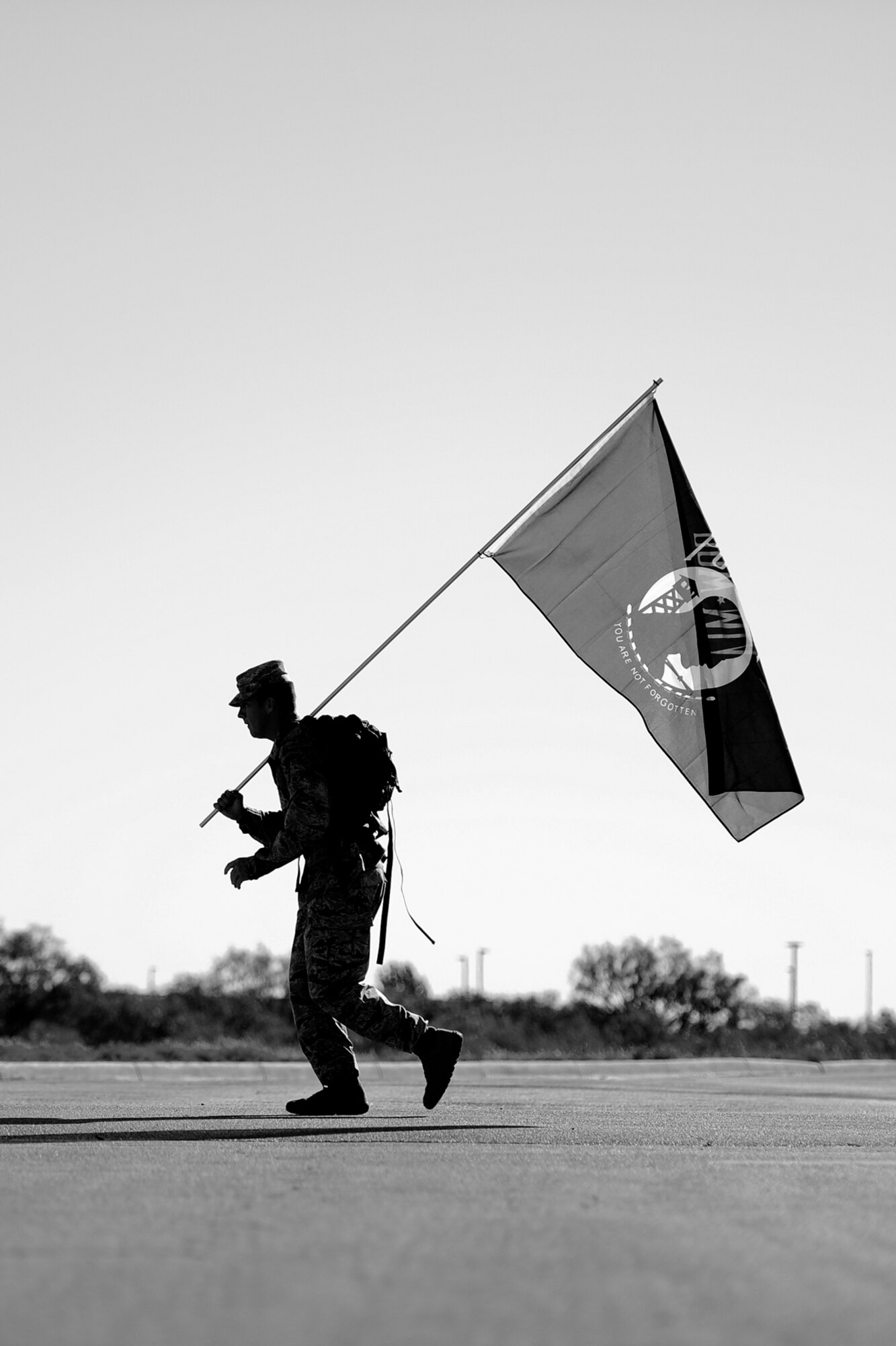 GOODFELLOW AIR FORCE BASE, Texas – Airman 1st Class Nicolas Long, 315th Training Squadron student, participates in the 8th Annual Airman 1st Class Jacobson 4.1-Mile Memorial Ruck March hosted by the 17th Security Forces Squadron Oct. 4. Long carried a POW/MIA flag along with his ruck for the entire length of the race. (Air Force photo/ Airman 1st Class Devin Boyer)