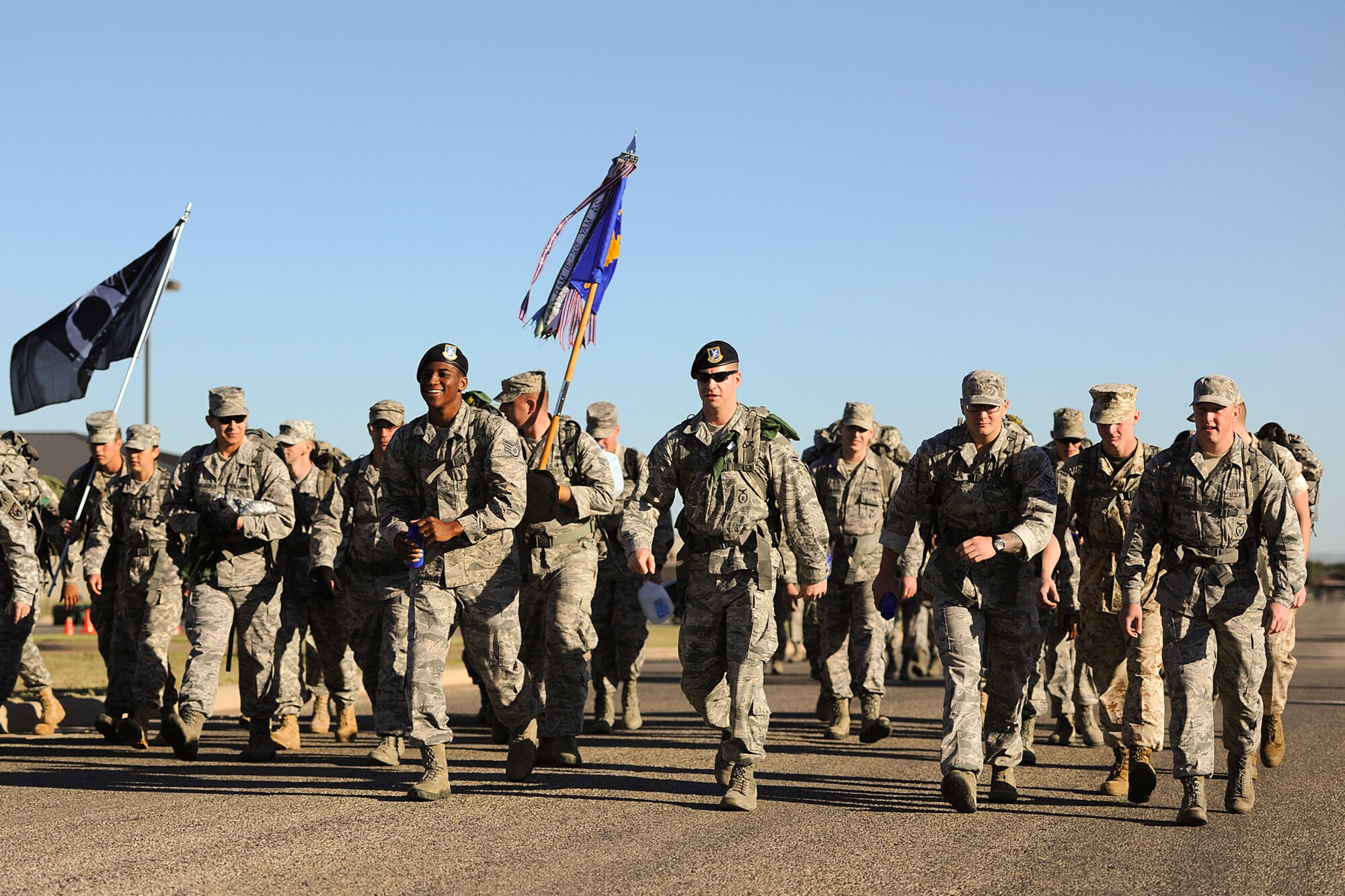 GOODFELLOW AIR FORCE BASE, Texas – Ruck march participants take off from the start during the 8th Annual Airman 1st Class Jacobson 4.1-Mile Memorial Ruck March Oct. 4. The event consisted of a team competition and a self-paced ruck march. (Air Force photo/ Airman 1st Class Devin Boyer)