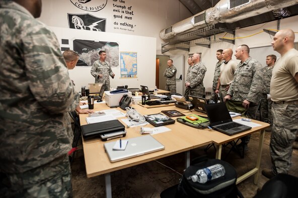 Air Force Lt. Col. Bruce Bancroft of the Kentucky Air National Guard’s 123rd Contingency Response Group talks to unit members about their role in Operation United Assistance during a briefing in the Joint Operations Center at Léopold Sédar Senghor International Airport in Dakar, Senegal, Oct. 5, 2014. The Kentucky Air Guardsmen stood up an Intermediate Staging Base at the airport that will funnel humanitarian supplies and equipment into West Africa as part of the international effort to fight Ebola. (U.S. Air National Guard photo by Maj. Dale Greer)