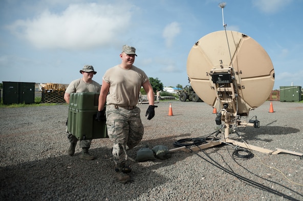 Air Force Staff Sgt. John May, left, and Air Force Senior Airman Alex Vincent of the Kentucky Air National Guard’s 123rd Contingency Response Group carry equipment into the Joint Operations Center at Léopold Sédar Senghor International Airport in Dakar, Senegal, Oct. 5, 2014, in support of Operation United Assistance. More than 80 Kentucky Air Guardsmen stood up an Intermediate Staging Base at the airport that will funnel humanitarian supplies and equipment into West Africa as part of the international effort to fight Ebola. (U.S. Air National Guard photo by Maj. Dale Greer)