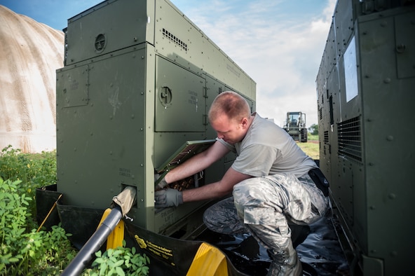 Air Force Senior Airman Courtnay Hester, a power production specialist with the Kentucky Air National Guard’s 123rd Contingency Response Group, sets up an electric generator to feed the Joint Operations Center at Léopold Sédar Senghor International Airport in Dakar, Senegal, Oct. 5, 2014, in support of Operation United Assistance. Hester and more than 80 other Kentucky Air Guardsmen stood up an Intermediate Staging Base at the airport that will funnel humanitarian supplies and equipment into West Africa as part of the international effort to fight Ebola. (U.S. Air National Guard photo by Maj. Dale Greer)