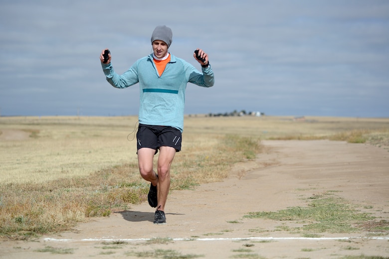 Tyler Stiles, 4th Space Operations Squadron, runs to the finish line during the 9th annual base half-marathon Oct. 3, 2014, at Schriever Air Force Base, Colo. Stiles won first place overall during the race. (U.S. Air Force photo/Christopher DeWitt)
