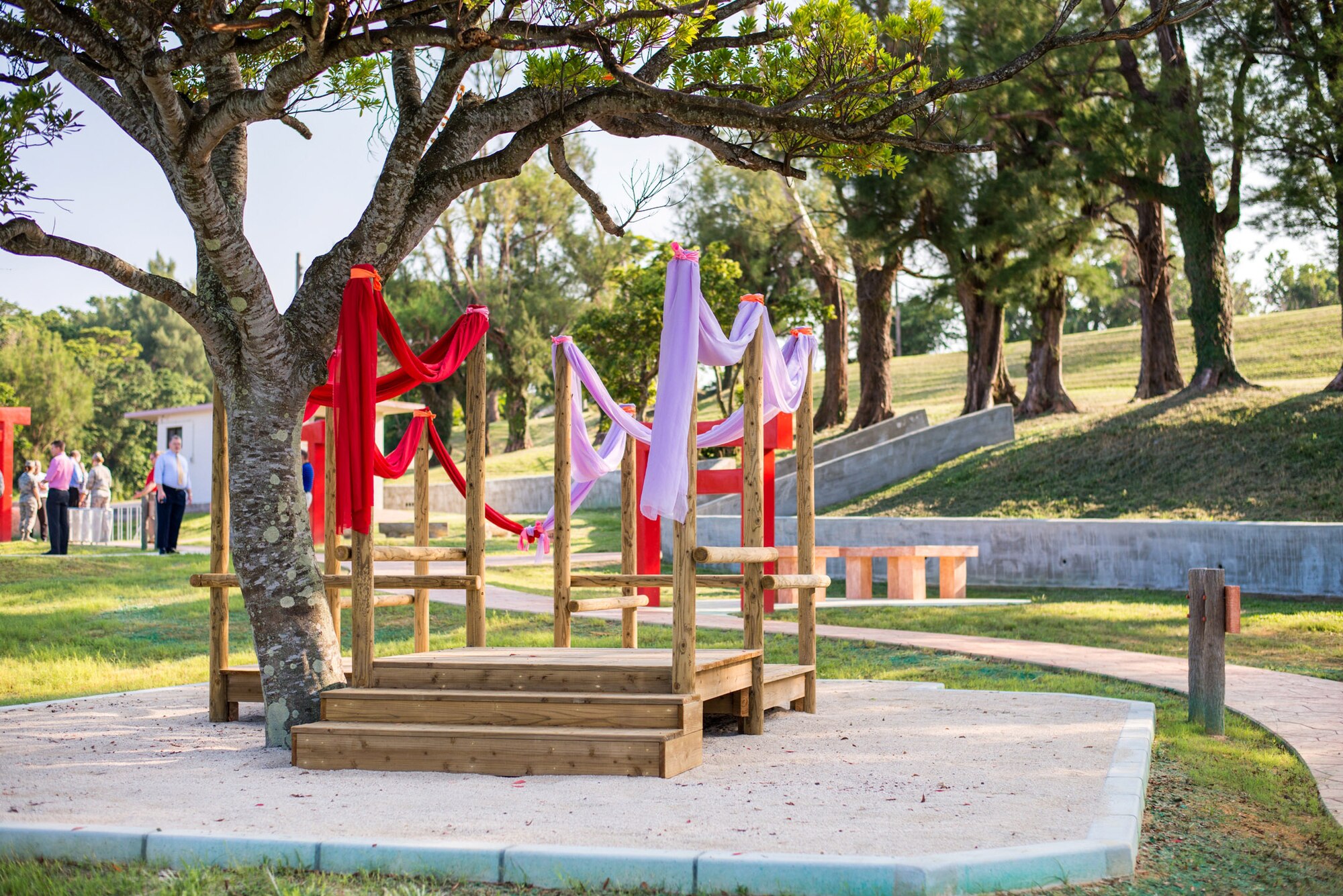 (left to right) U.S. Air Force Col. Debra Lovette, 18th Mission Support Group commander, cuts the ribbon with Kiyoshi Higa, 18th Contacting Squadron contracting administrator; Staff Sgt. San Ha Guerrero, 18th CONS contracting administrator; Tom Harter, 18th Force Support Squadron facilities manager; and Maj. Joel Hearn, 718th Civil Engineer Squadron engineer flight commander, at the grand opening of the Marek Park Nature Play Area on Kadena Air Base, Japan, Sept. 30, 2014. Marek Park now boasts Pacific Air Force's first Nature Play Area with stations for a variety of creative play options. (Photo by Ryan Burger)