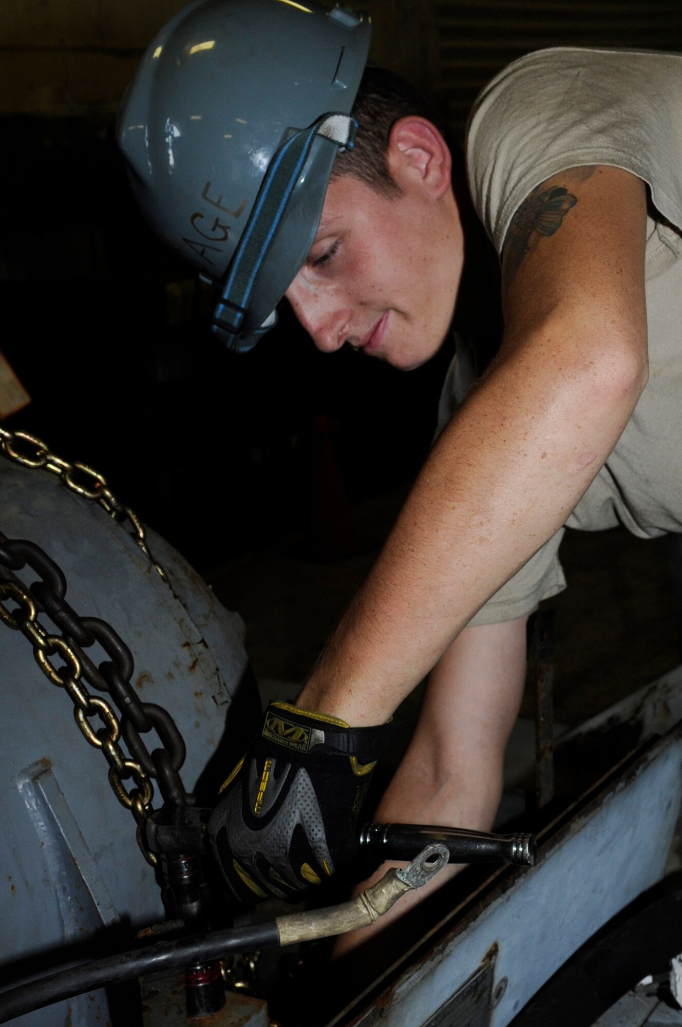 U.S. Air Force Airman 1st Class Jordan Wolverton, 18th Equipment Maintenance Squadron aircraft ground equipment technician, unbolts an engine to be taken in for depot-level maintenance while on Kadena Air Base, Japan, Oct. 6, 2014. Depot-level maintenance is completed back in the U.S and is an extensive overhaul. (U.S. Air Force photo by Senior Airman Marcus Morris/Released)