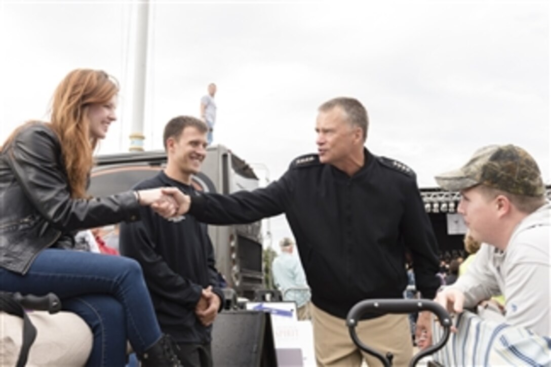 Navy Adm. James A. Winnefeld Jr., vice chairman of the Joint Chiefs of Staff, attends the Invincible Spirit Festival hosted by the Gary Sinise Foundation and Naval Support Activity Bethesda in Bethesda, Md., Oct. 7, 2014. 