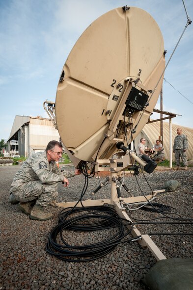 Master Sgt. Paul Edwards establishes satellite communications for the joint operations center Oct. 5, 2014, at Léopold Sédar Senghor International Airport in Dakar, Senegal, in support of Operation United Assistance. More than 80 Airmen from the Kentucky Air National Guard stood up an intermediate staging base at the airport that will funnel humanitarian supplies and equipment into West Africa as part of the international effort to fight Ebola. Edwards is a member of the Kentucky ANG’s 123rd Contingency Response Group. (U.S. Air National Guard photo/Maj. Dale Greer)