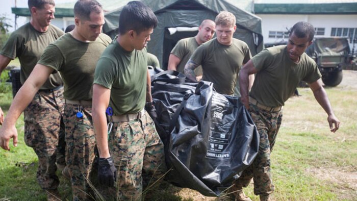 U.S. Navy corpsmen carry a tent that will be used for a shock trauma aid station during Amphibious Landing Exercise 15 here Sept. 30. PHIBLEX is an annual, bilateral training exercise conducted by members of the Armed Forces of the Philippines alongside U.S Marine and Navy forces focused on strengthening the partnership and relationships between the two nations across a range of military operations including disaster relief and complex expeditionary operations. The corpsmen are with Combat Logistics Battalion 31, 31st Marine Expeditionary Unit.