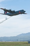 A 146th Airlift Wing C-130J during MAFFS (Modular Airborne Fire Fighting System) annual training and re-certification held at the146th Airlift Wing, Channel Islands Air National Guard Station. Media and visitors were present nearby to watch this drop near Point Mugu, Calif., April 9, 2014. 