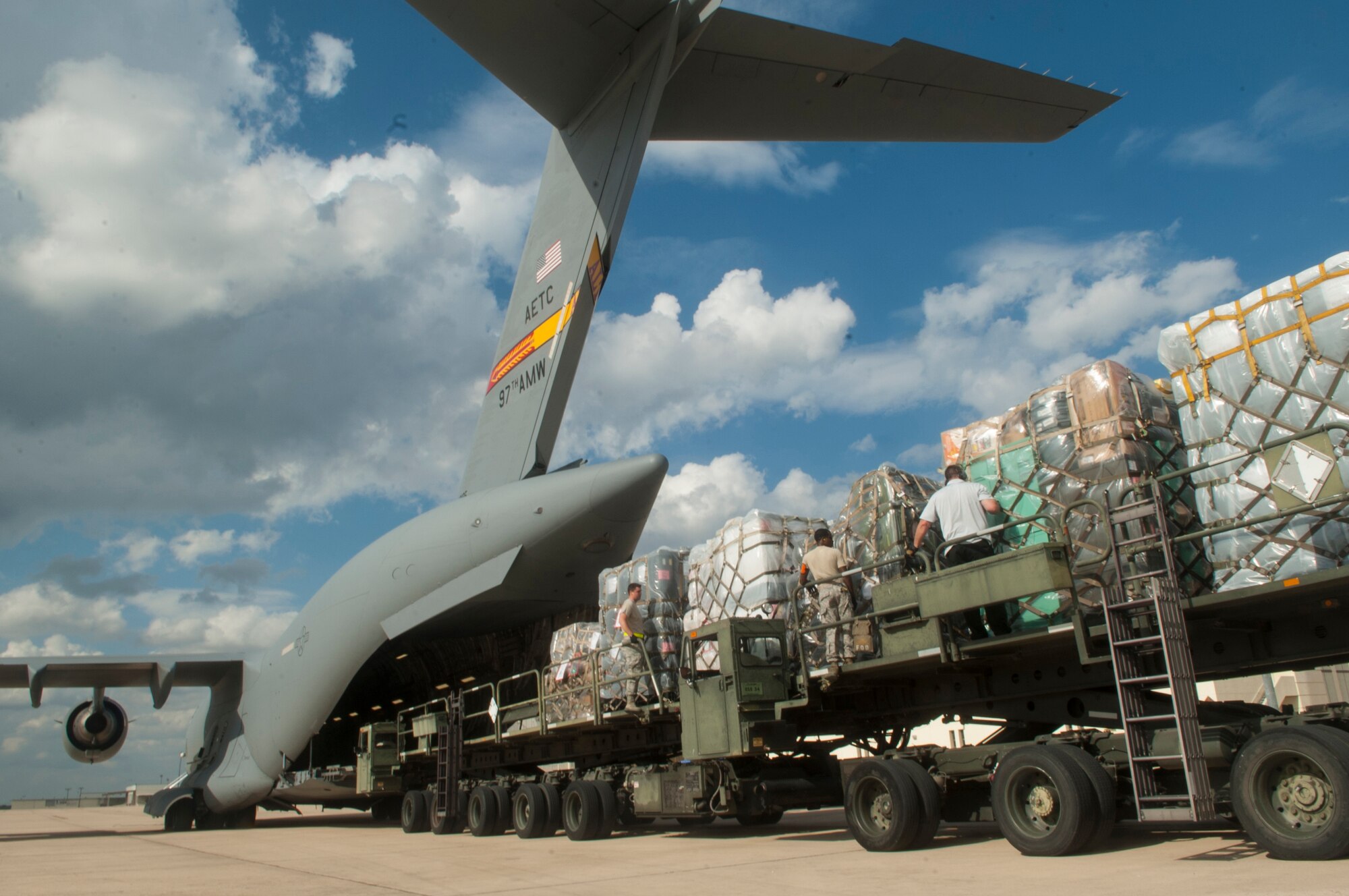 Medical supplies from the Air Force Medical Operations Agency are loaded onto a C-17 Globemaster III  Sept. 26, 2014, at Joint Base San Antonio-Lackland, Texas. The C-17 is assigned to the 97th Air Mobility Wing, deployed from Altus Air Force Base, Okla., and supported Operation United Assistance. (U.S. Air Force photo/Airman Justine K. Rho)