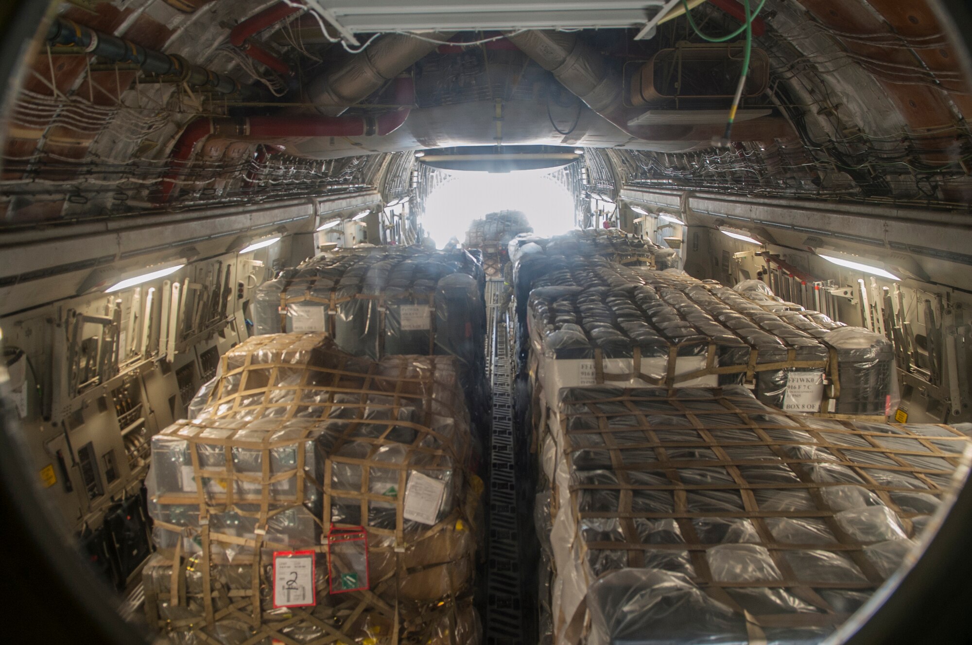 Medical supplies from the Air Force Medical Operations Agency are loaded onto a C-17 Globemaster III Sept. 26, 2014, at Joint Base San Antonio-Lackland, Texas. The supplies were being sent in support of Operation United Assistance to help treat patients and halt the spread of the Ebola virus. The supplies will support field hospitals and aid workers battling the virus in Monrovia, Liberia. The C-17 is assigned to the 97th Air Mobility Wing. (U.S. Air Force photo/Airman Justine K. Rho