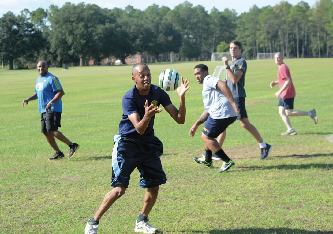 Petty Officer 3rd Class Aundrea Maddox, plays offense during the Naval Branch Health Clinic staff’s weekly physical fitness Fun Day handball game, at Marine Corps Logistics Base Albany, recently.