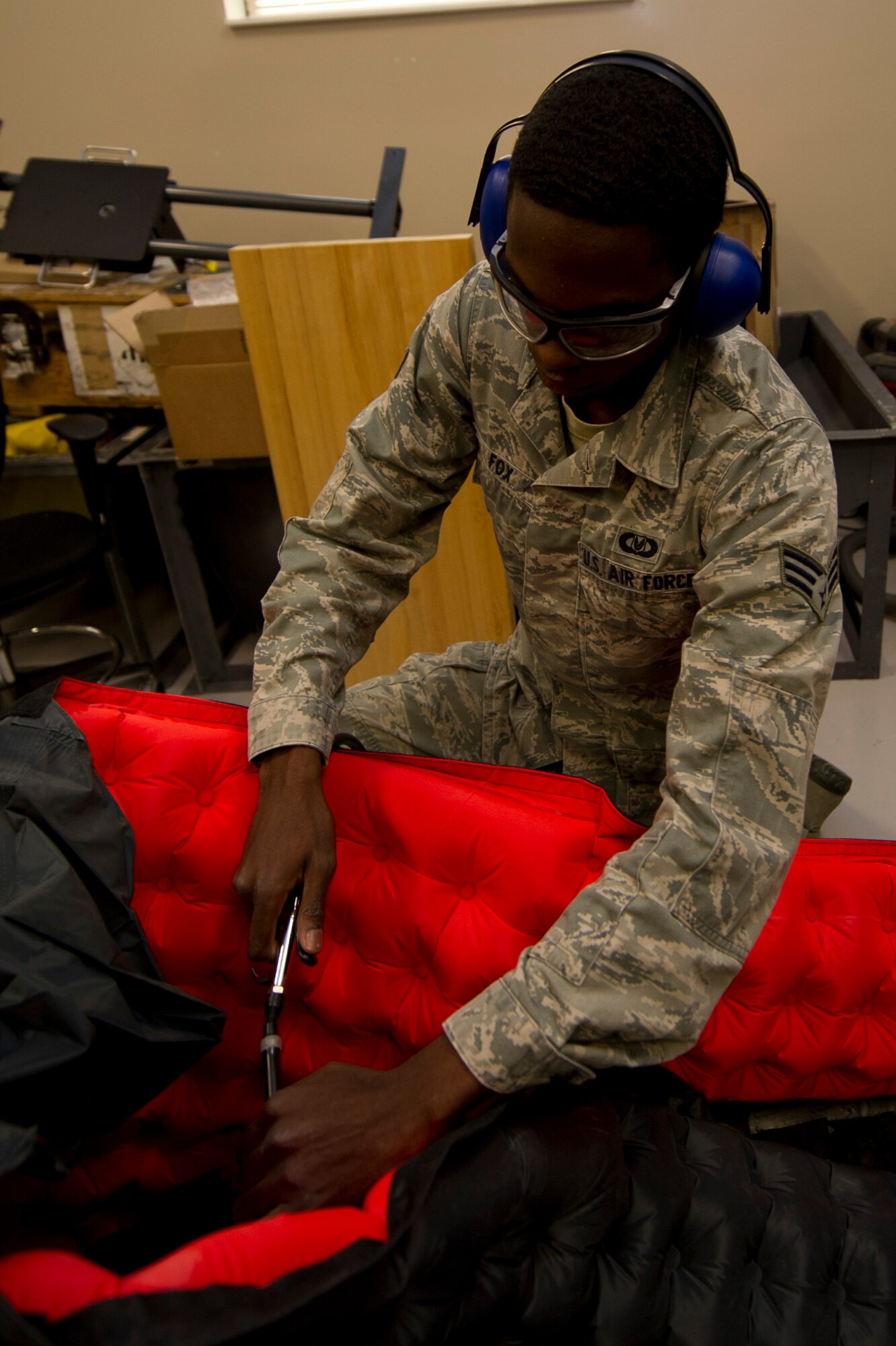 Senior Airman Daniel Fox, 319th Special Operations Squadron aircrew flight equipment journeyman, performs a leak test on a one-man life raft at the 1st Special Operations Group Detachment 1 building on Hurlburt Field, Fla. Oct. 7, 2014. A six-hour leak test is accomplished before flight to ensure the raft isn’t leaking air, making it unserviceable. (U.S. Air Force photo/Senior Airman Krystal M. Garrett)