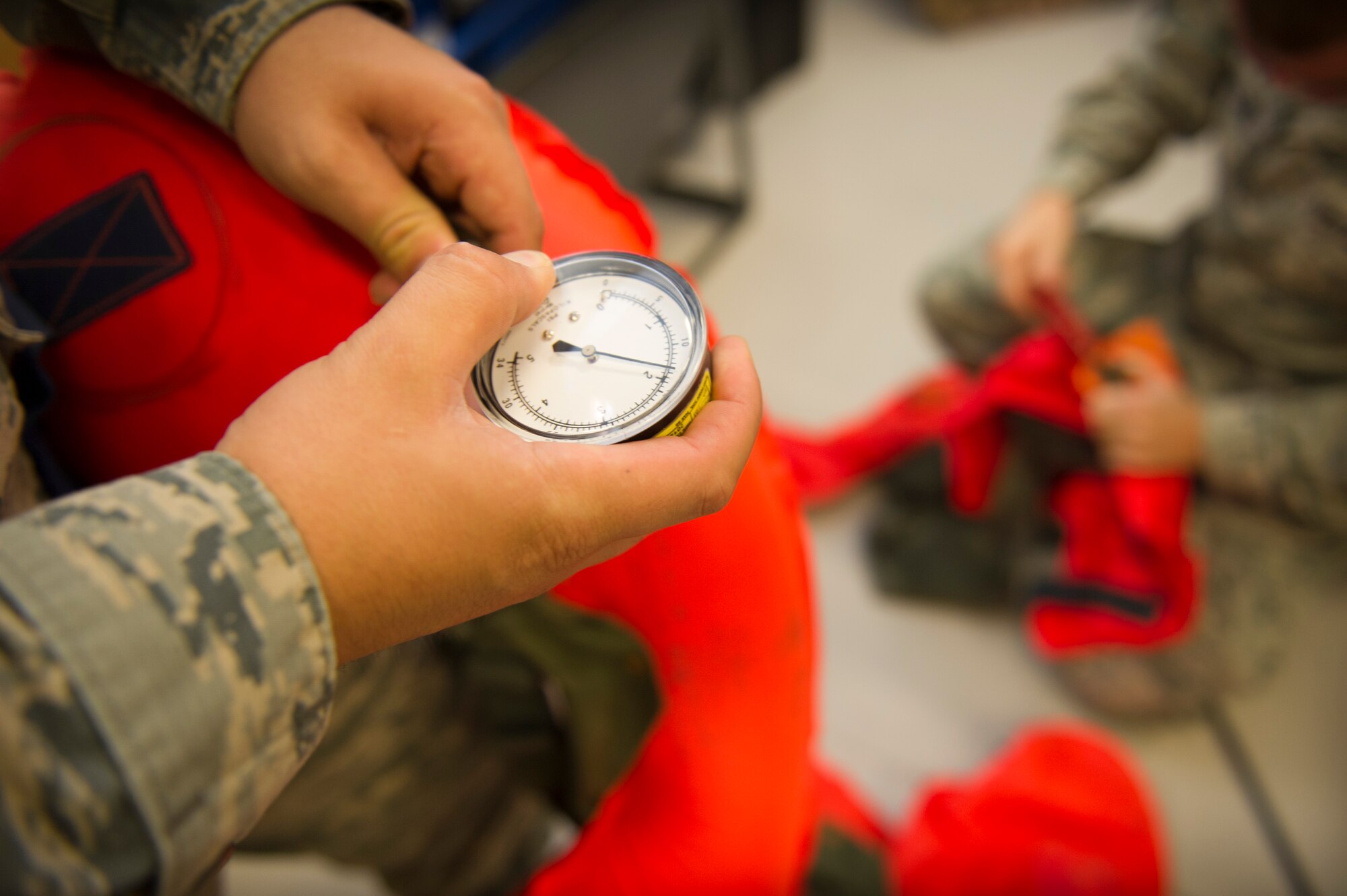 Aircrew flight equipment Airmen prepare survival kits at the 1st Special Operations Group Detachment 1 building on Hurlburt Field, Fla., Oct. 7, 2014. The kits include equipment in the event of an emergency egress. (U.S. Air Force photo/Senior Airman Krystal M. Garrett)