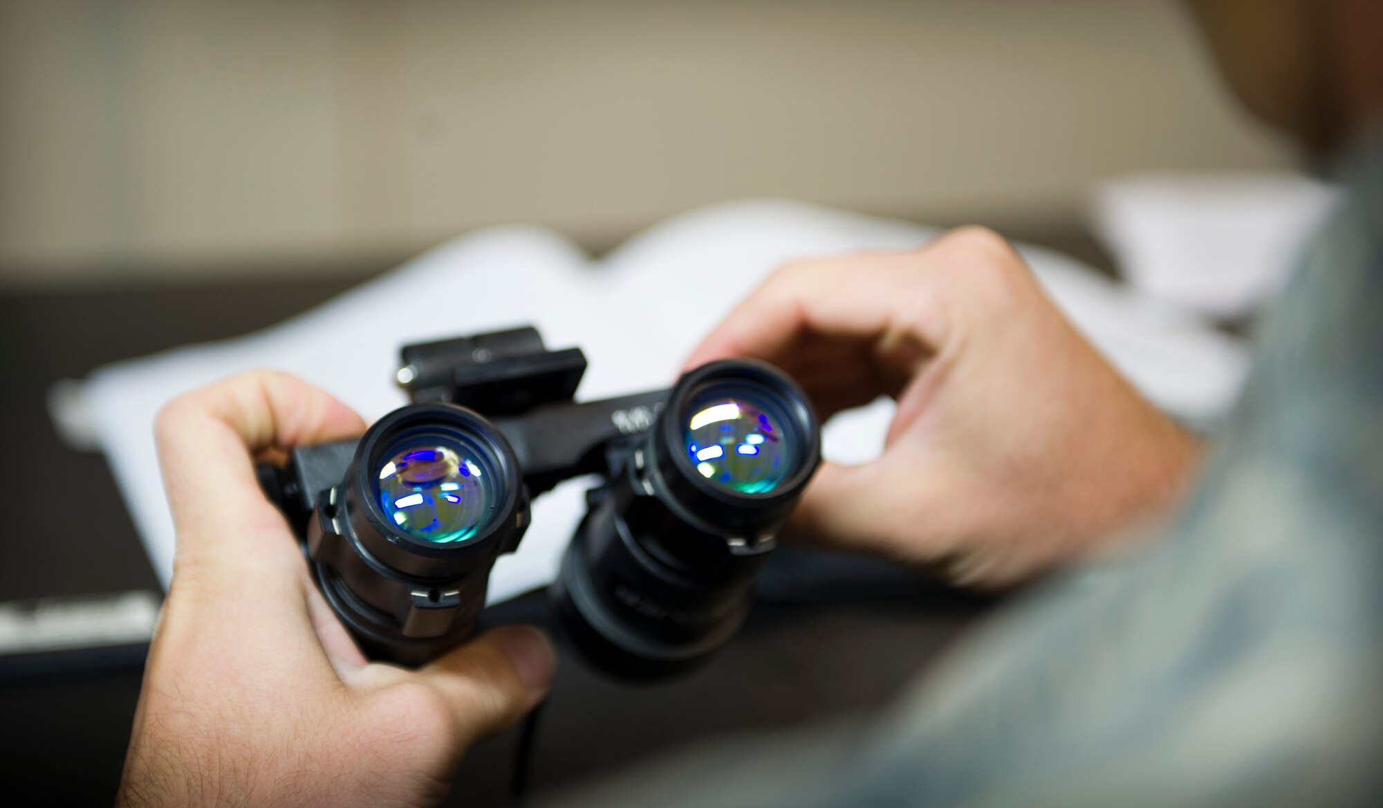 Senior Airman Jacob Wade, 34th Special Operations Squadron aircrew flight equipment journeyman, inspects night vision goggles at the 1st Special Operations Group Detachment 1 building on Hurlburt Field, Fla., Oct. 7, 2014. Night vision googles are used to assist aircrew when operating aircraft during hours of darkness. (U.S. Air Force photo/Senior Airman Krystal M. Garrett)