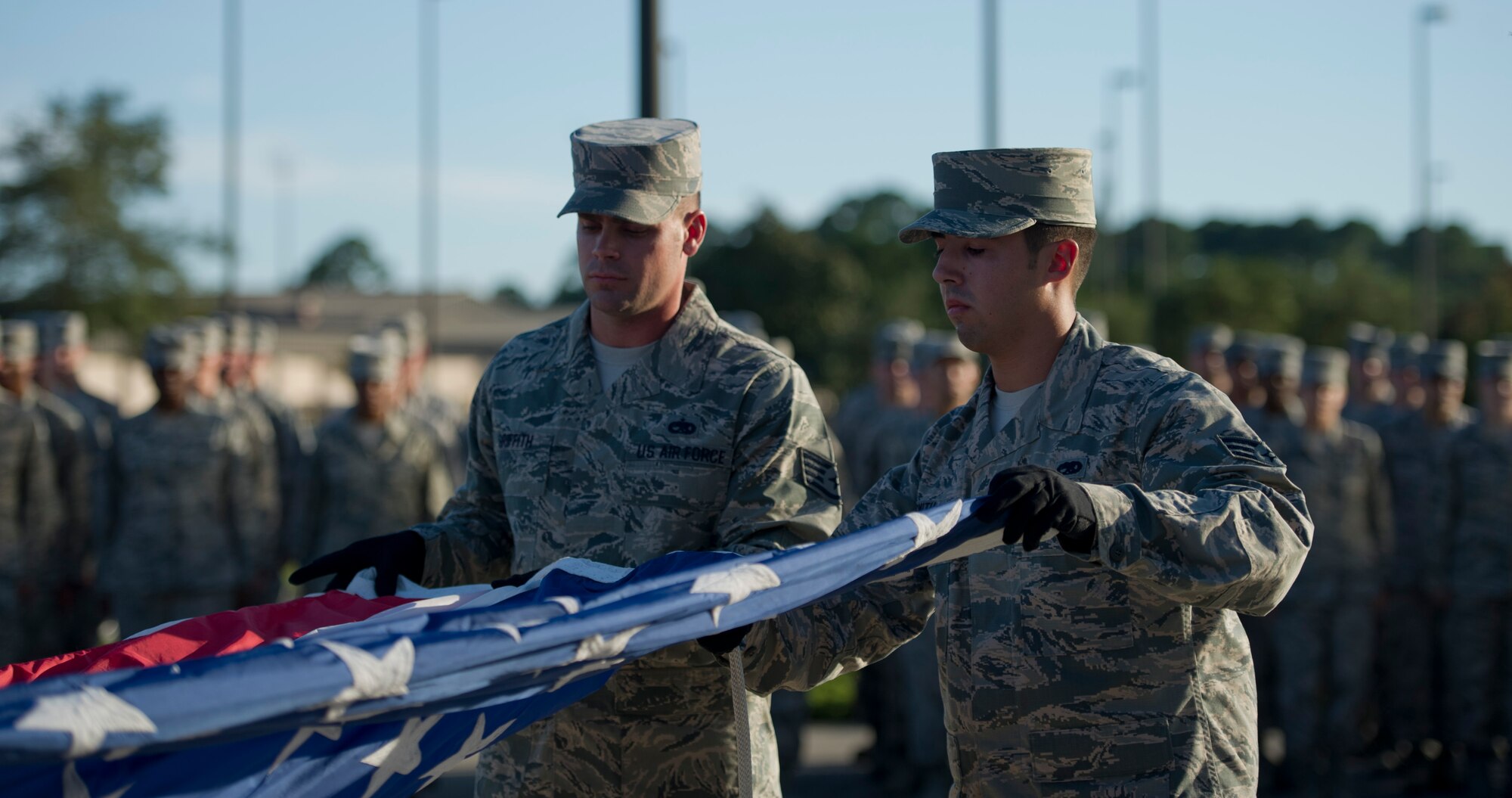 Honor Guard Airmen from the 1st Special Operations Wing fold the United States Flag during retreat at Hurlburt Field, Fla., Oct. 8, 2014. (Air Force photo/Senior Airman Krystal M. Garrett)
