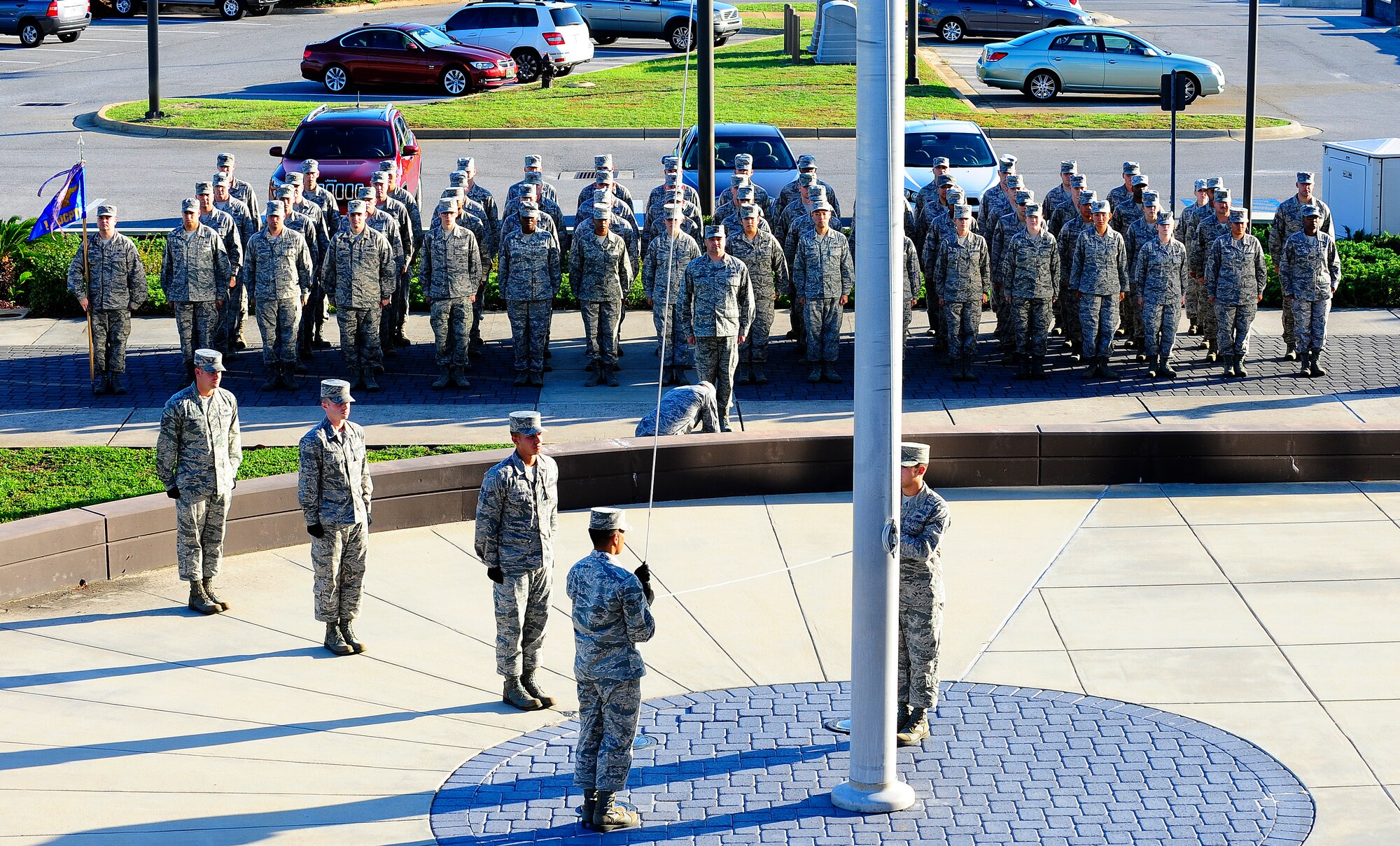 Members of the 1st Special Operations Wing, Wing Staff Agency and members of the Honor Guard conduct a retreat ceremony at the wing headquarters building at on Hurlburt Field, Fla., Oct. 8, 2014. Retreat is a 122-second ceremony carried out every day by honor guard personnel and base members to end the duty day. (U.S. Air Force photo/Airman 1st Class Andrea Posey)
